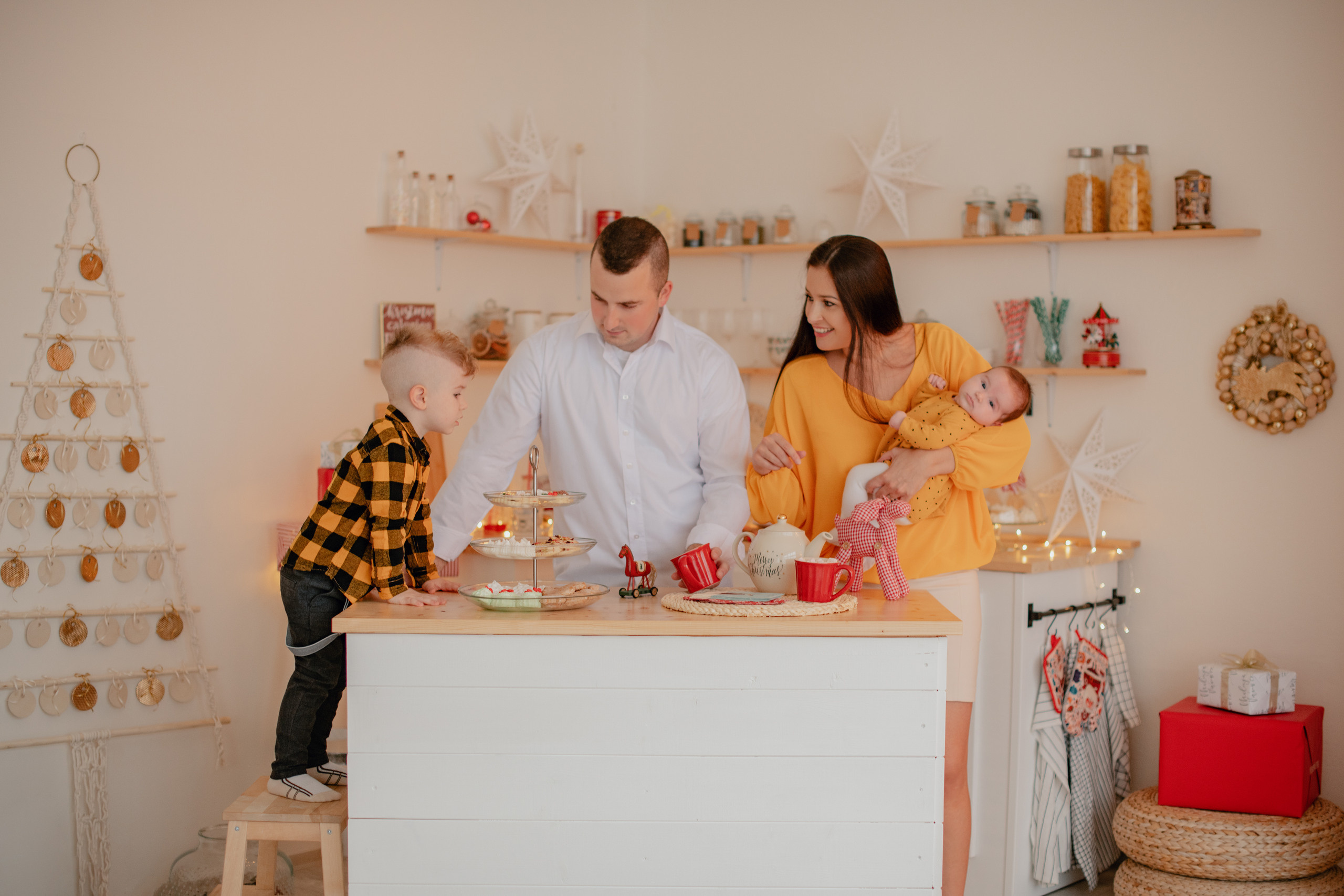 Family photography in a Christmas studio in Prague. Professional photographer in Prague Anastasia Haritonova