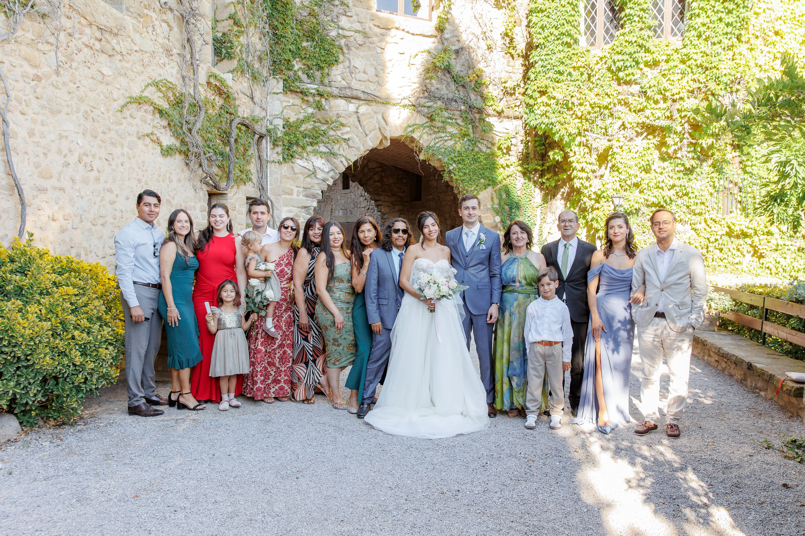 Family portrait of wedding guests posing together at a scenic Barcelona wedding location, celebrating the special day.