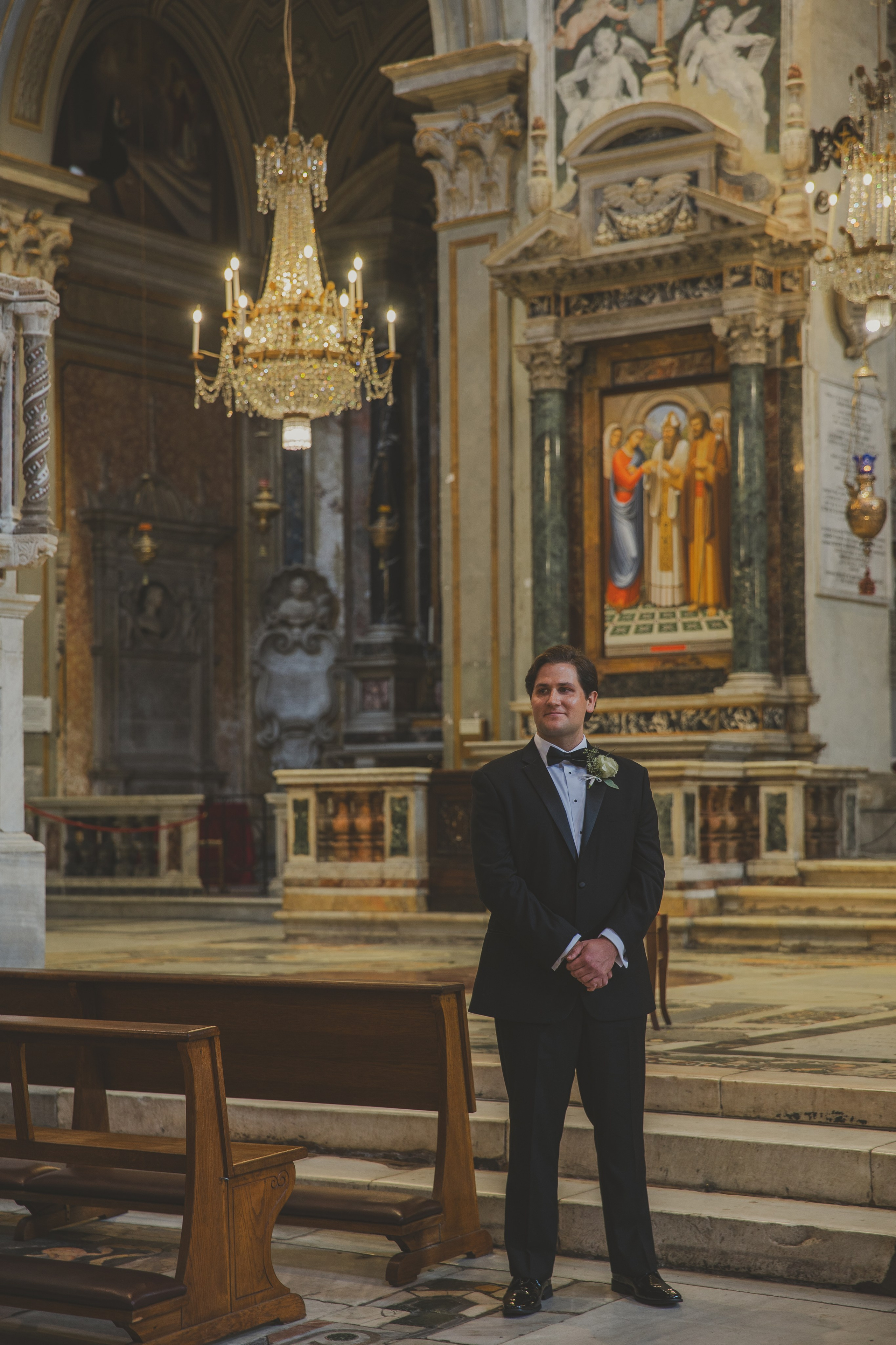 The groom standing at the altar of Santa Maria in Aracoeli, eagerly waiting for his bride.