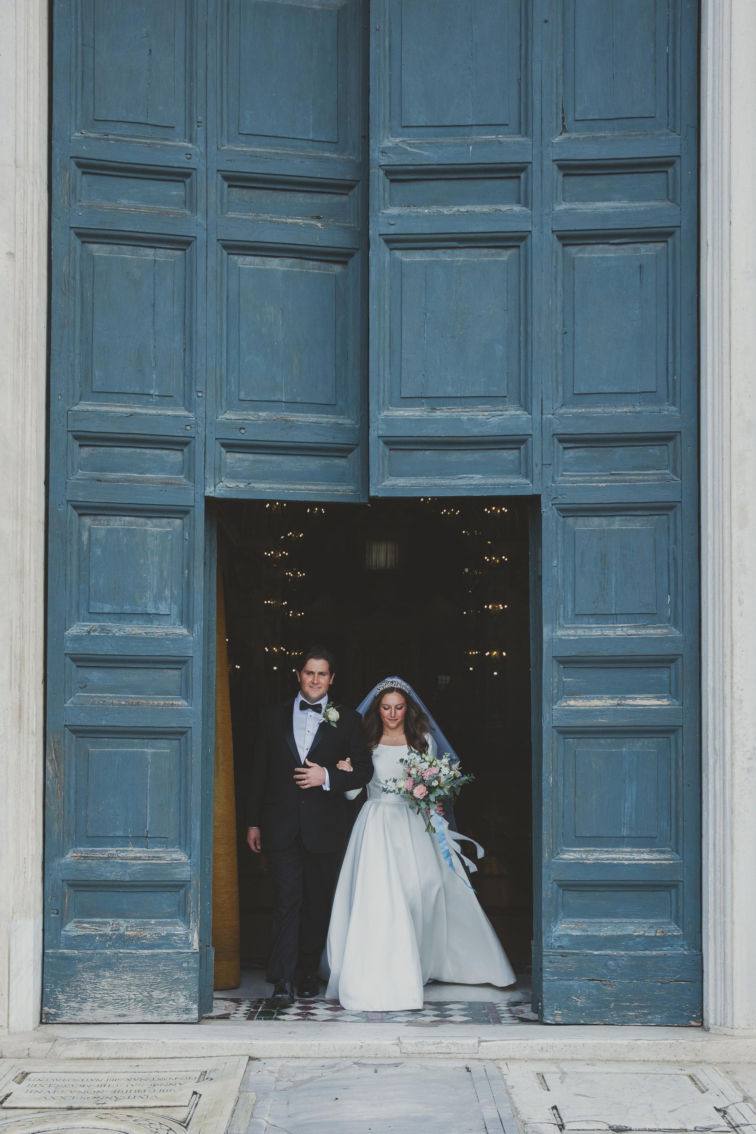 Couple exiting Santa Maria in Aracoeli church as newlyweds.