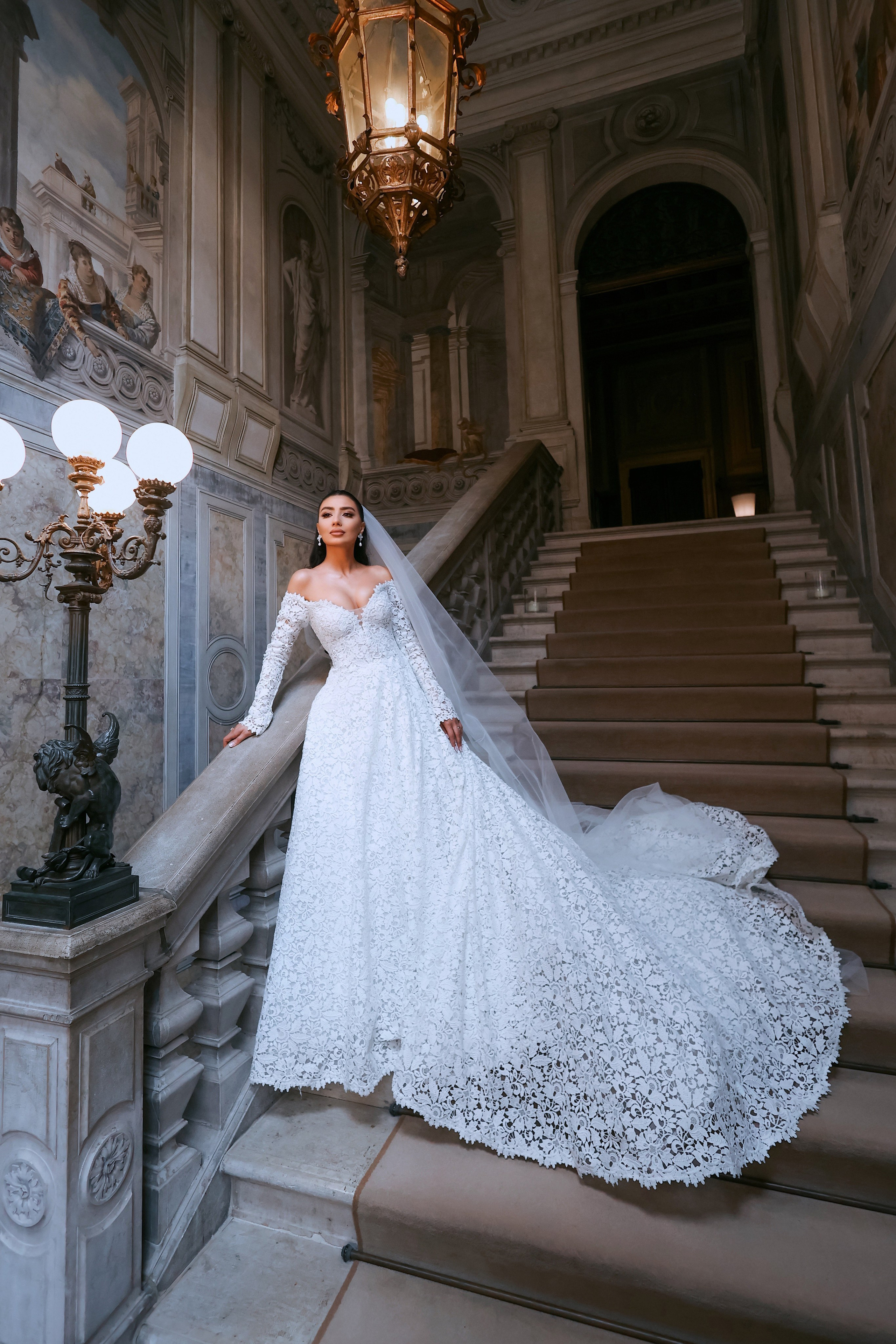 Armenian bride in white dress standing in the serene courtyard of Aman Venice