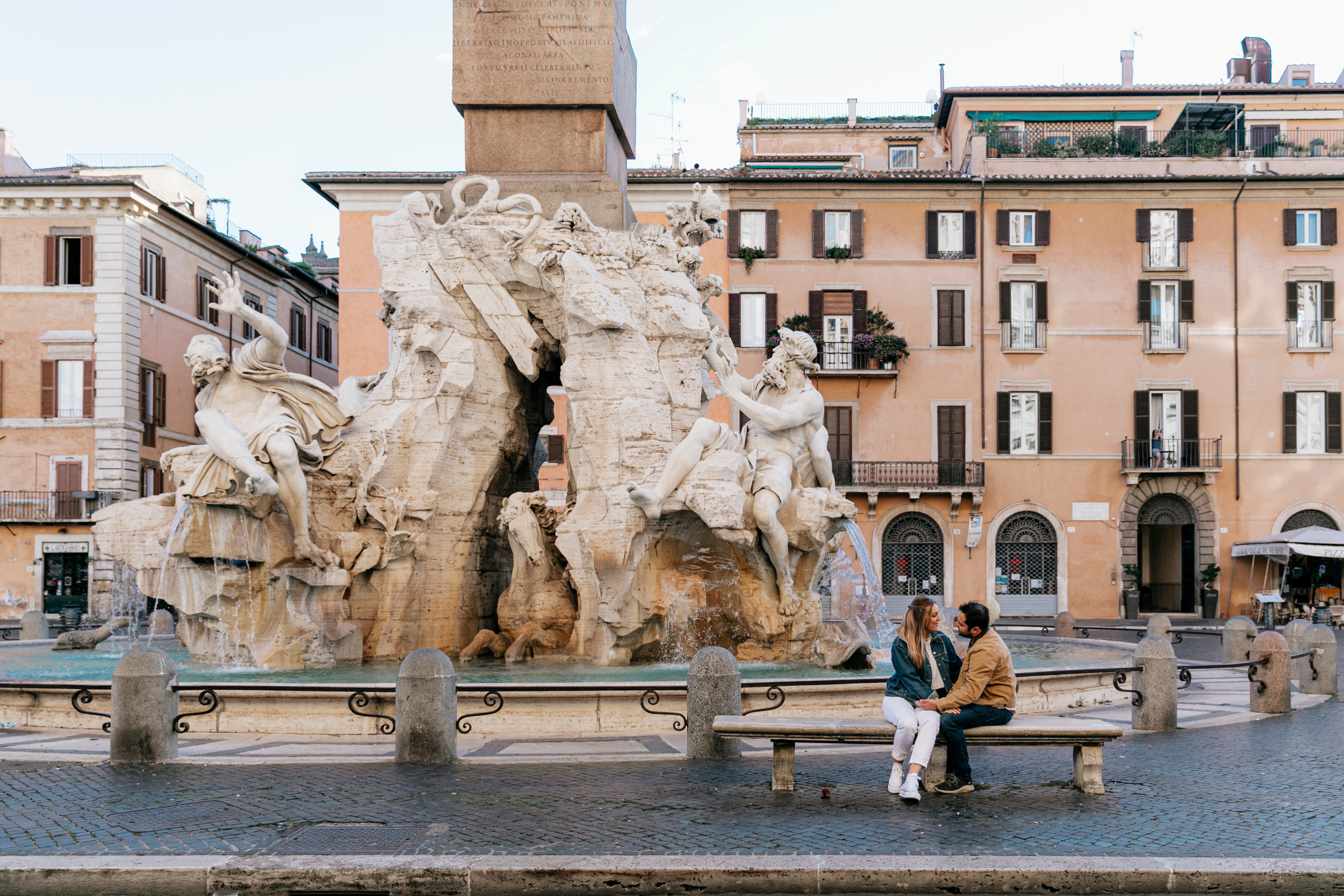 THREE COINS IN THE TREVI FOUNTAIN. Photographer in Rome