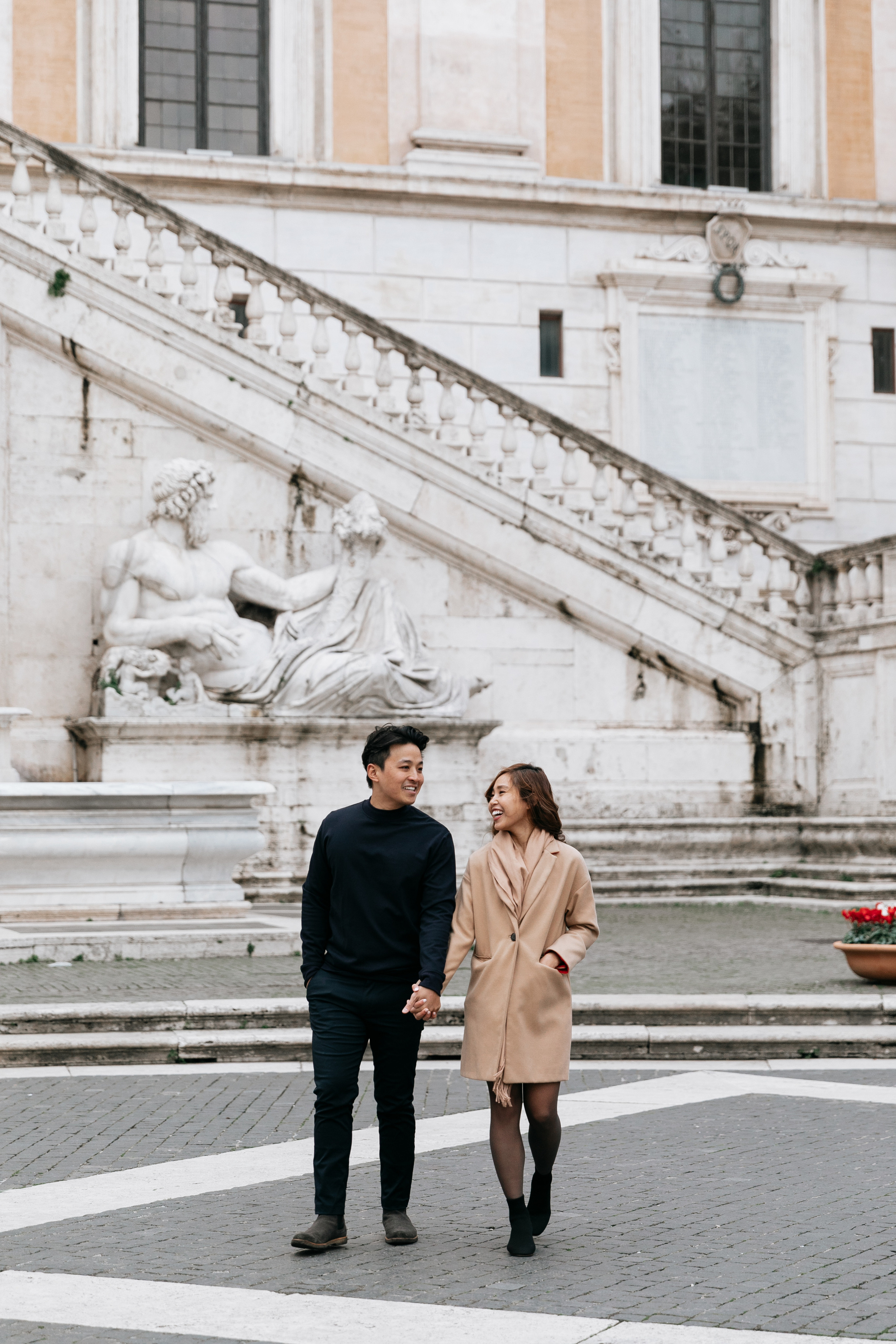 THREE COINS IN THE TREVI FOUNTAIN. Photographer in Rome