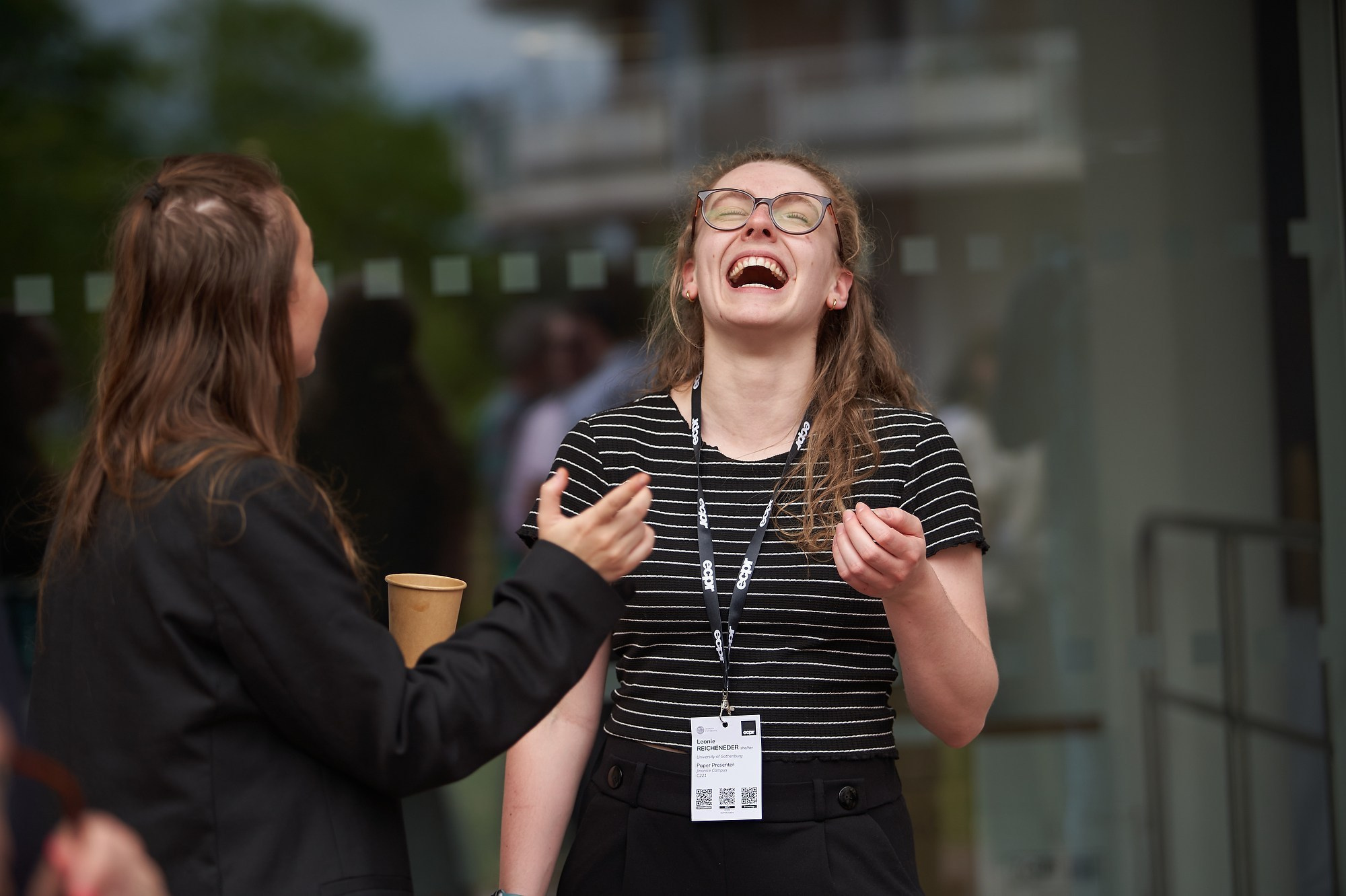A scholar laughs out loud as she mingles with fellow ECPR workshop attendees.