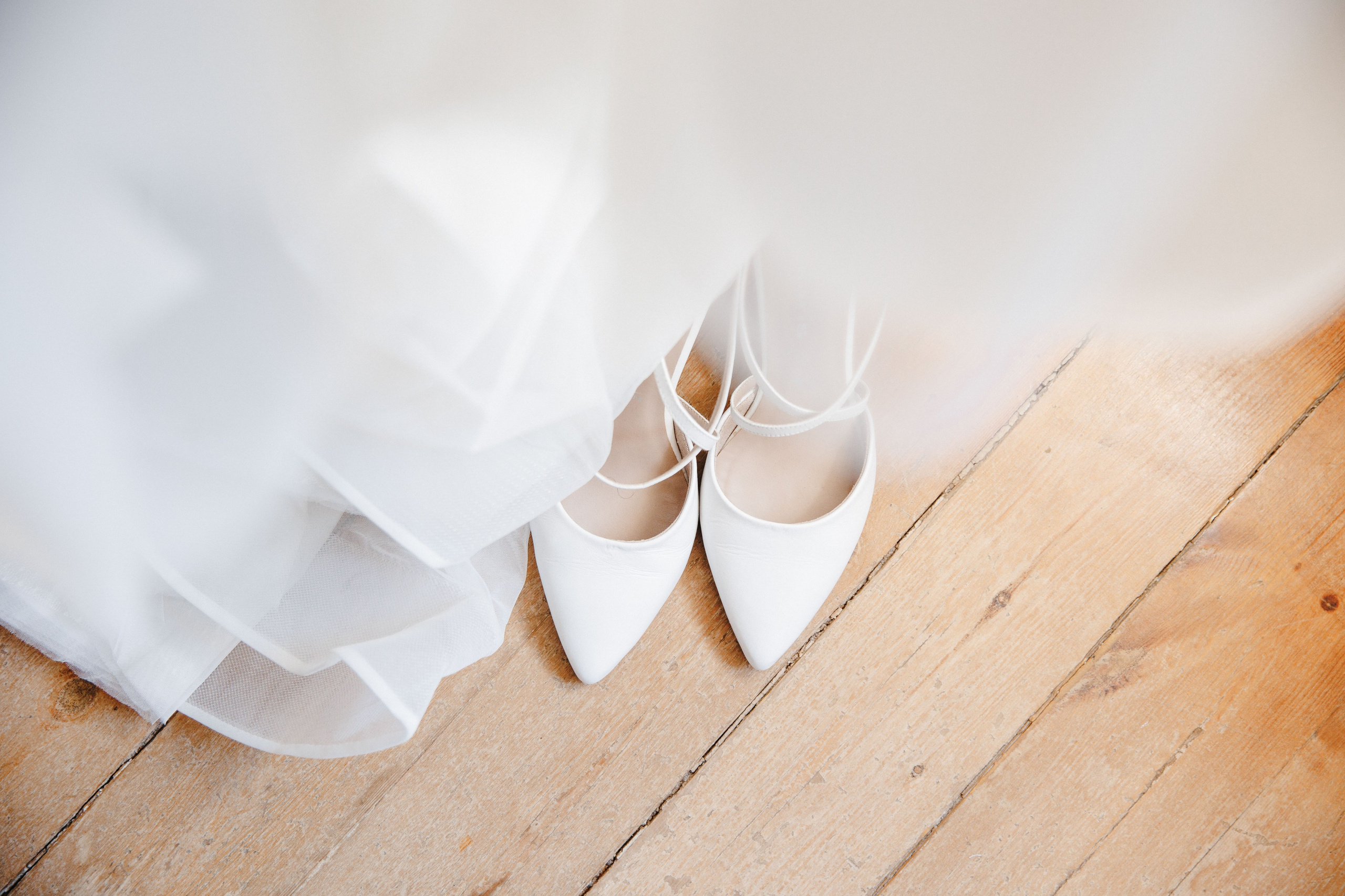 Elegant bridal dress and wedding shoes, styled for a destination wedding in Barcelona.