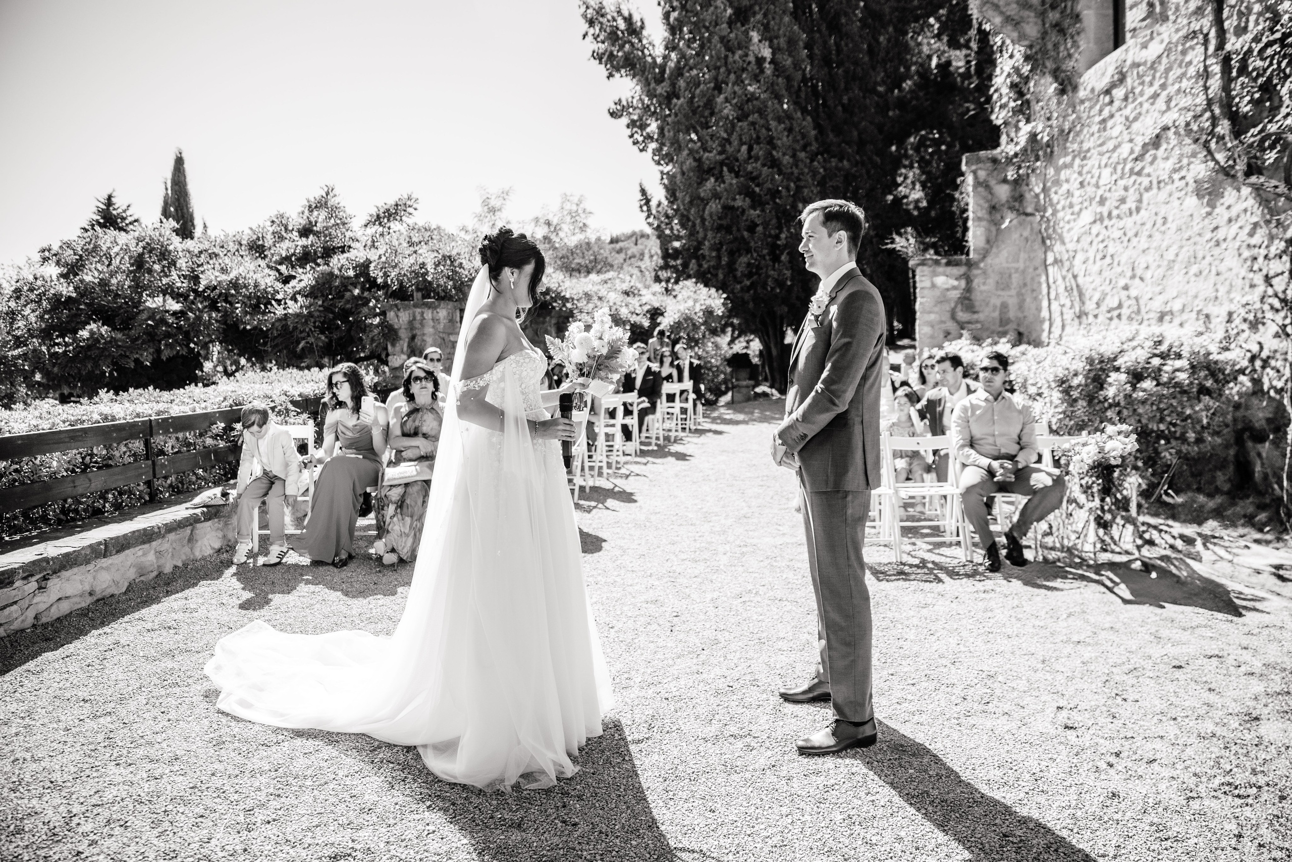 Bride and groom sharing a romantic first look in front of the wedding venue in Spain.