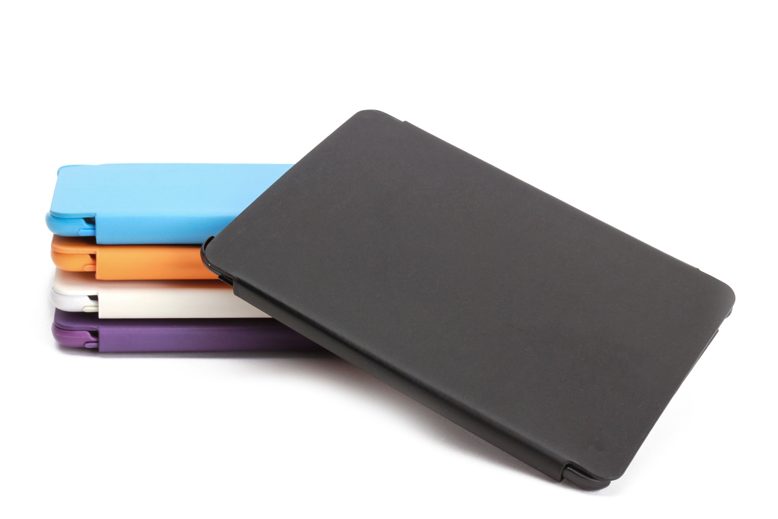 Stack of colorful tablet cases in black, blue, orange, white, and purple