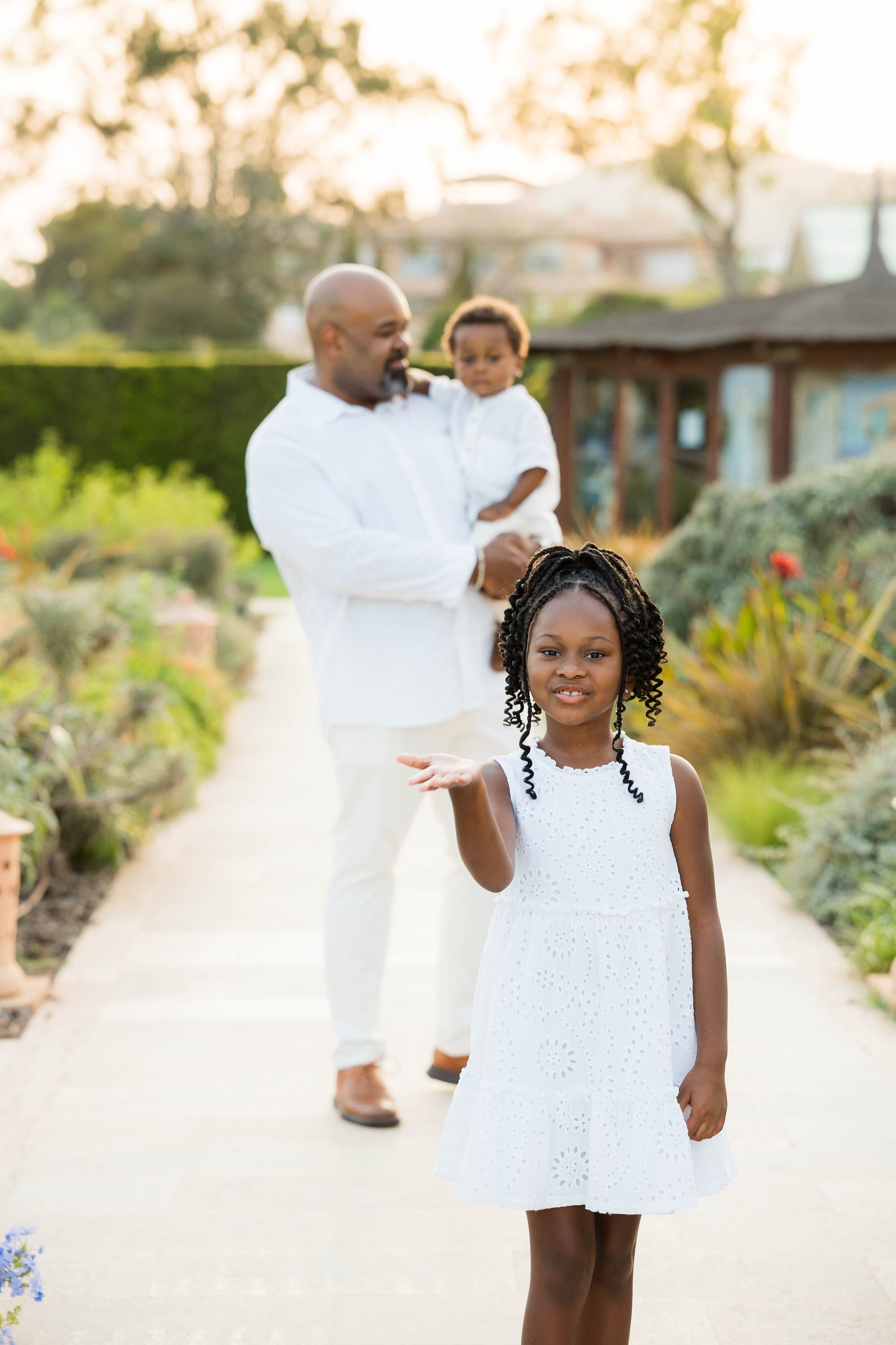 Father and children having Family Portraits at St. Regis Mardavall in Mallorca