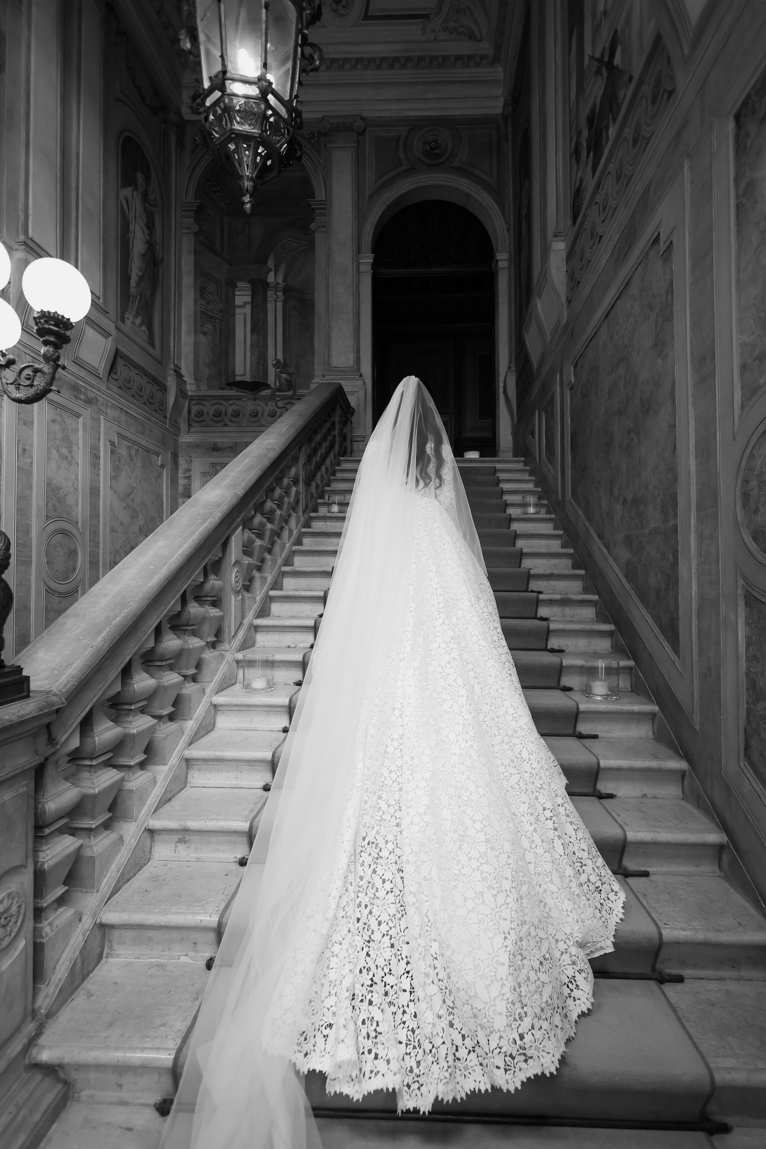Dramatic photo of Armenian bride with her veil flowing in the courtyard of Aman Venice