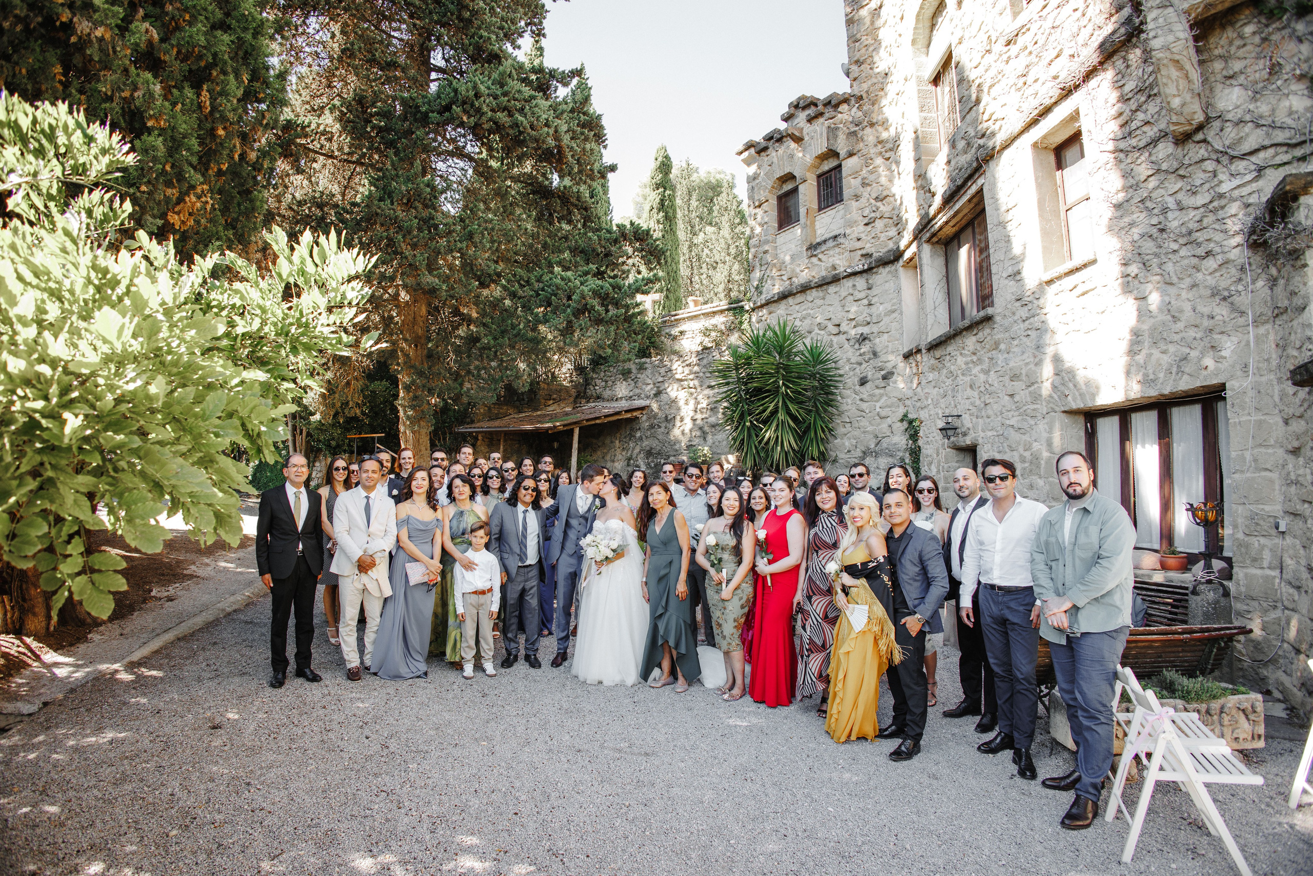 Bride and groom surrounded by their guests after the wedding ceremony in Barcelona.