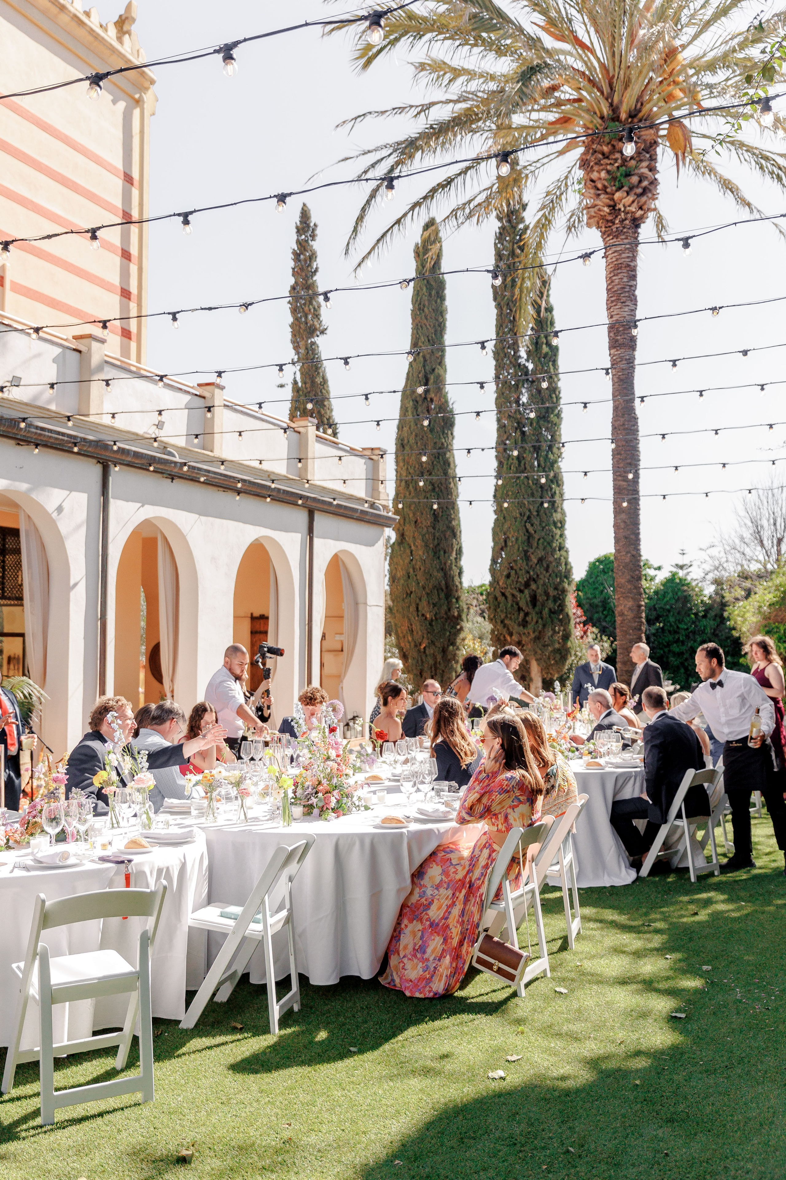 Luxury outdoor wedding reception under string lights in Barcelona