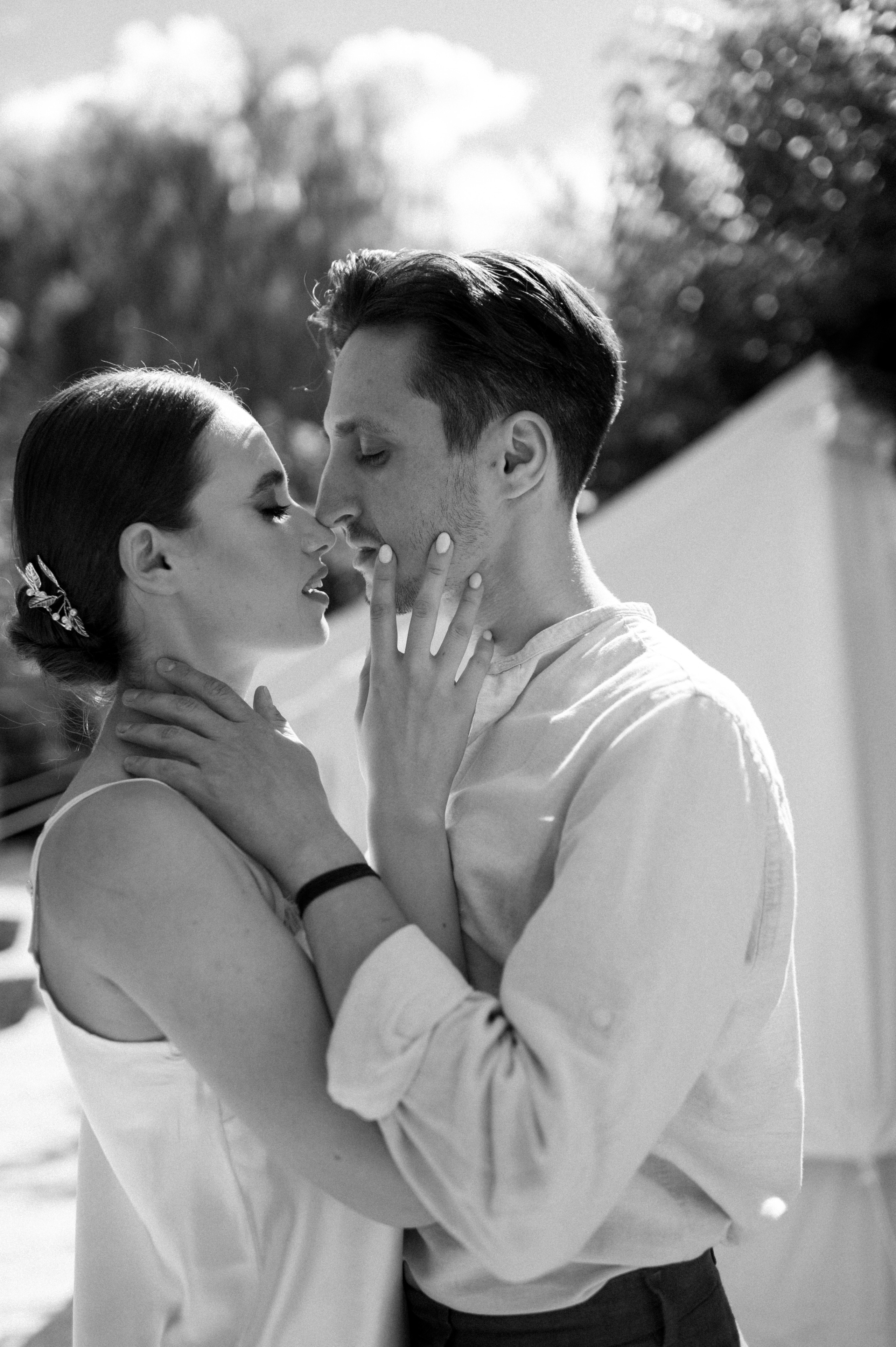 Within the serenity of a hidden garden gem, the couple's wedding morning is embraced in glamping tents, creating an intimate space for their loving gestures and tender moments.