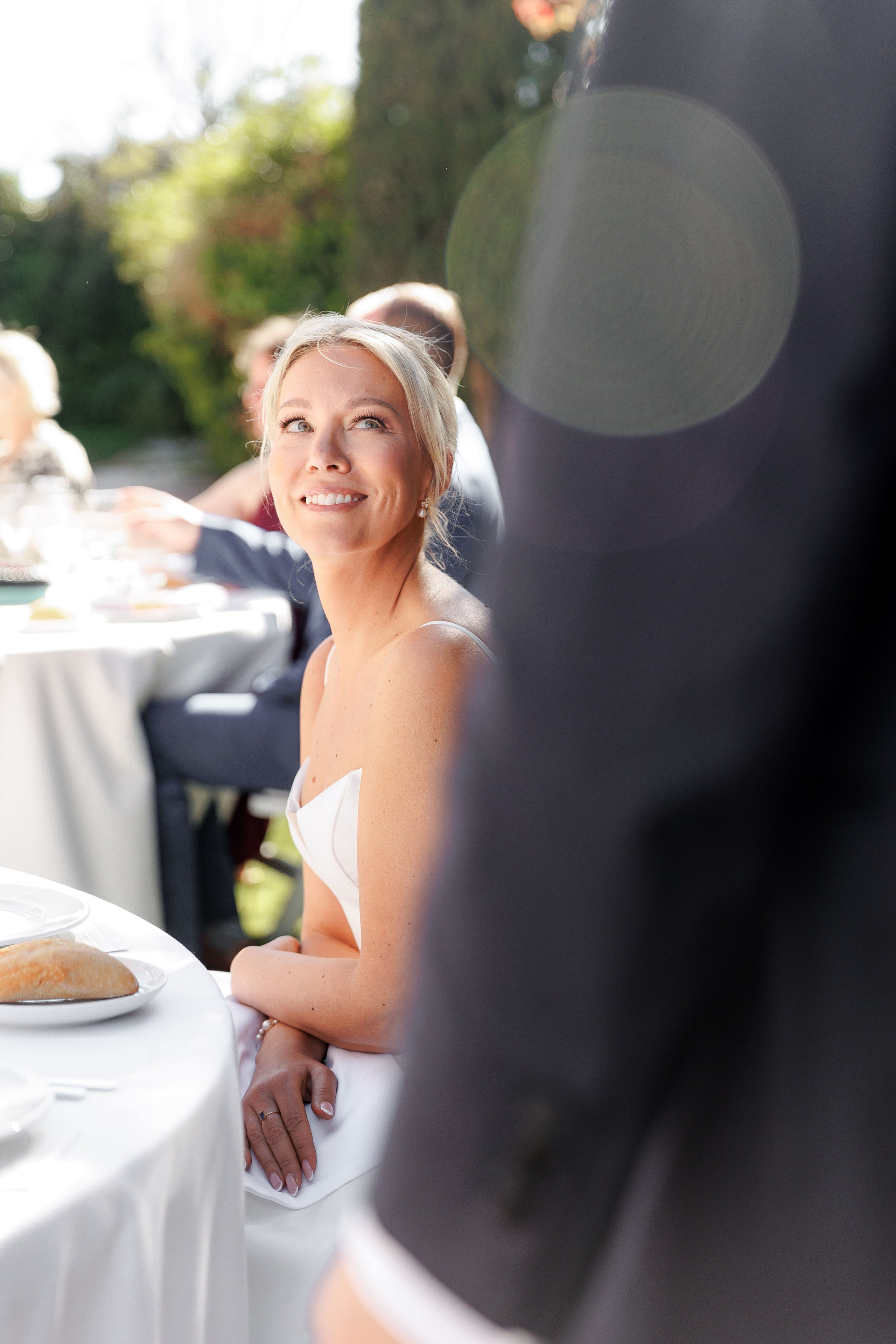 Bride is looking at the groom with eyes full of love and tender.