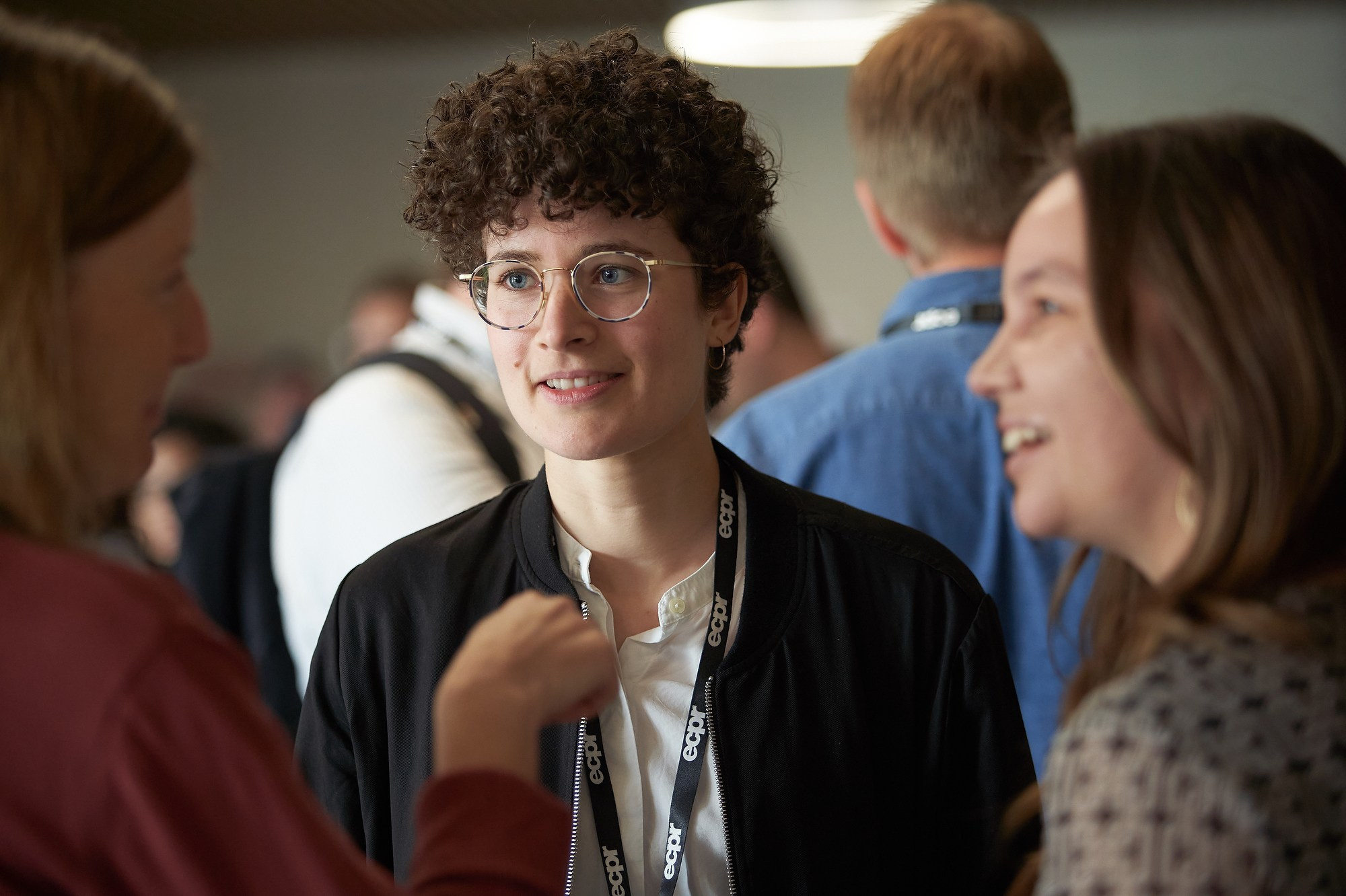 Smiling scholars mingle during a break at the ECPR conference.