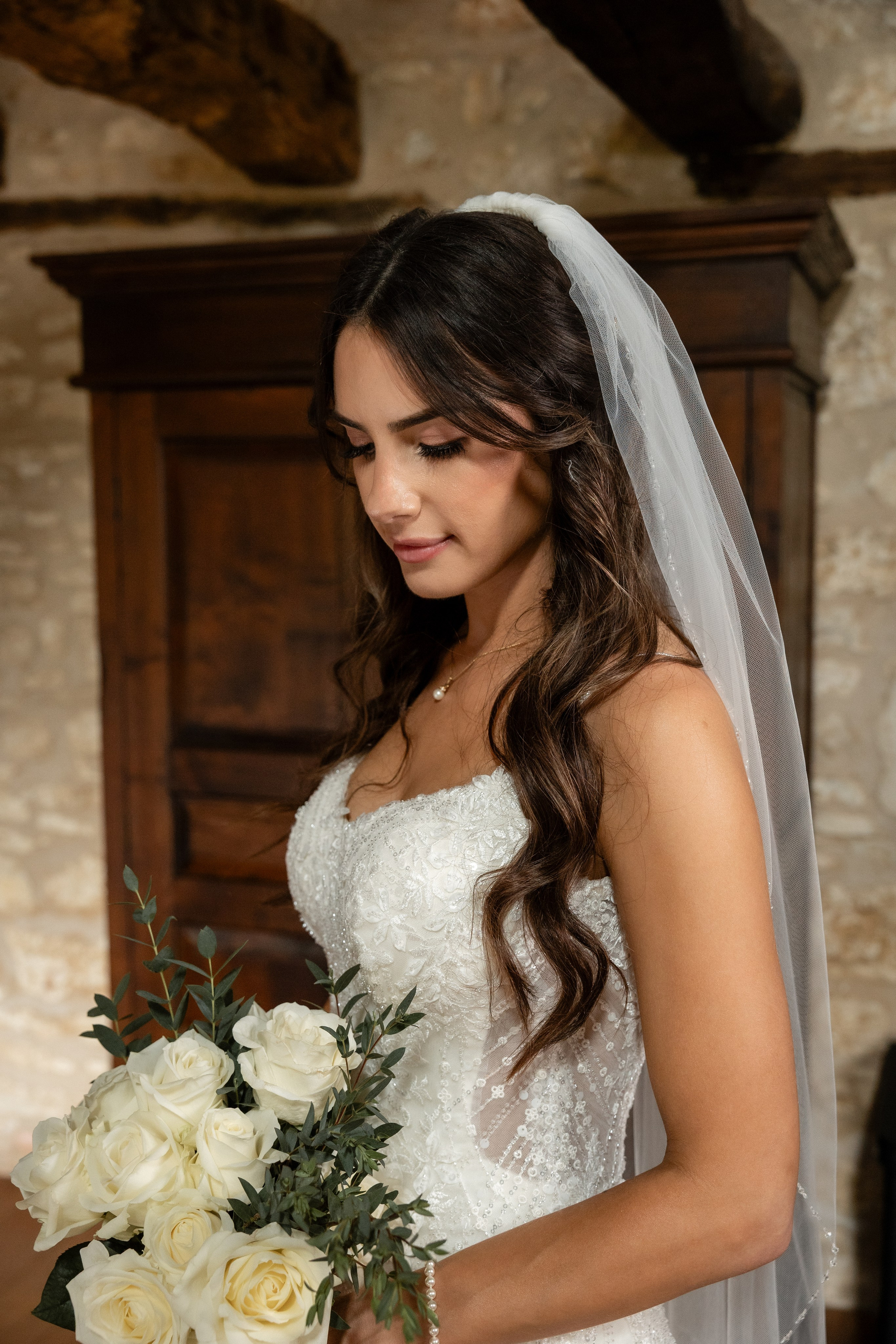 Fine art portrait of the bride inside Château Lagut during rainy wedding day.