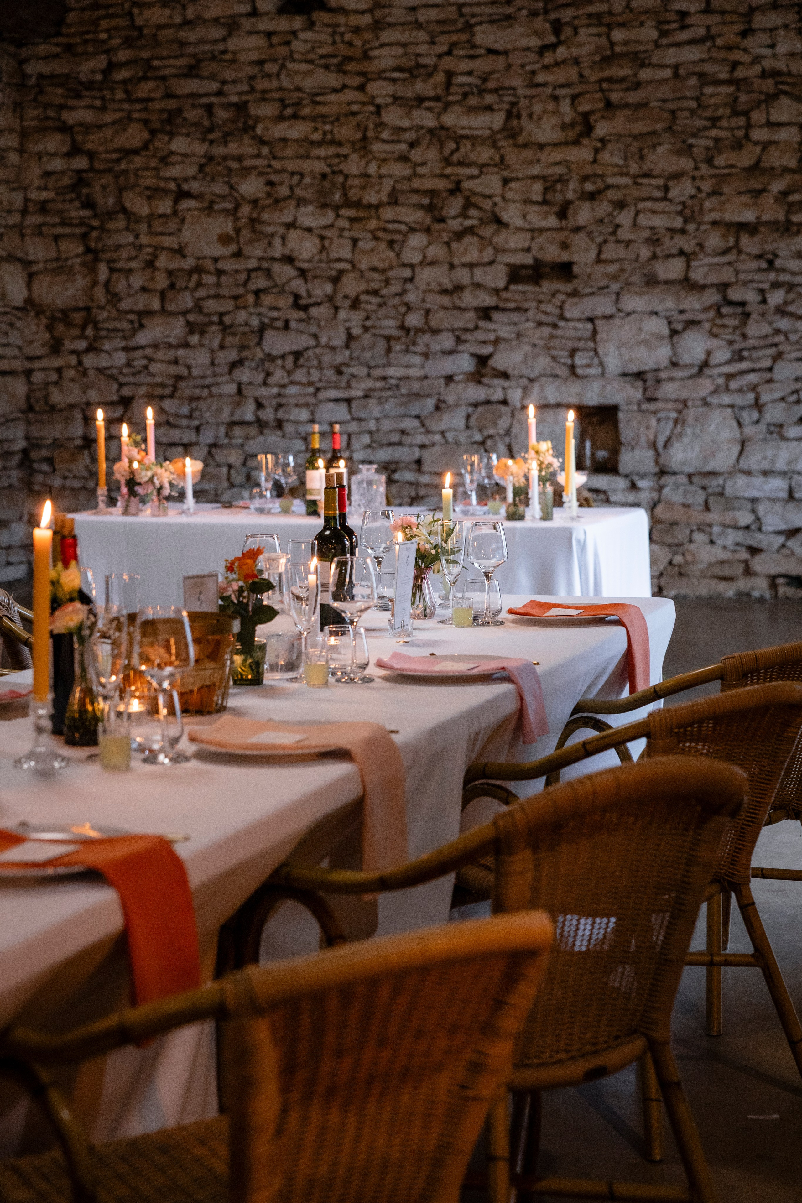 Candlelit wedding dinner indoors at Château Lagut, Dordogne France.