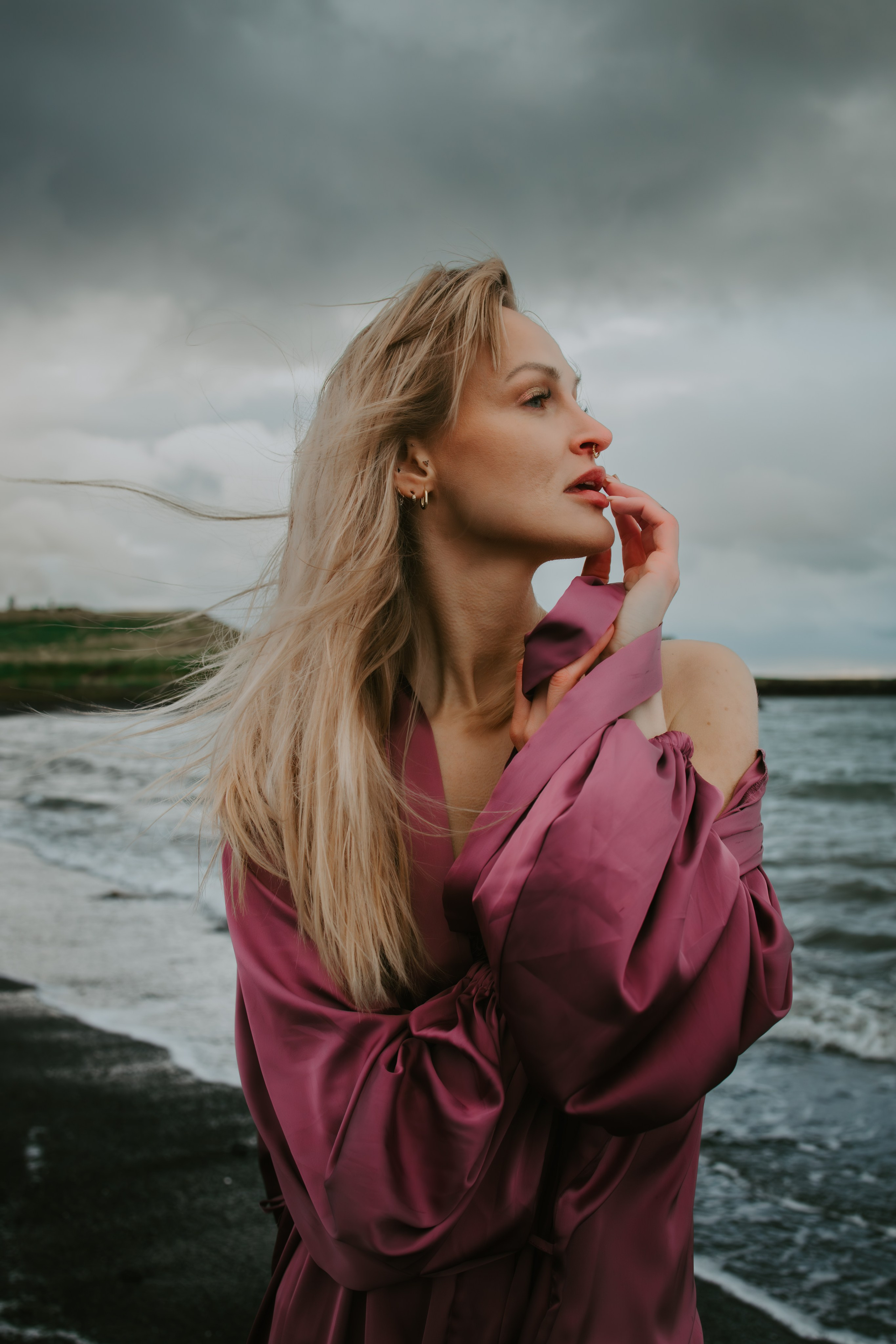 Iceland photography sessions in stunning landscapes, including waterfalls, mountains, and black sand beaches