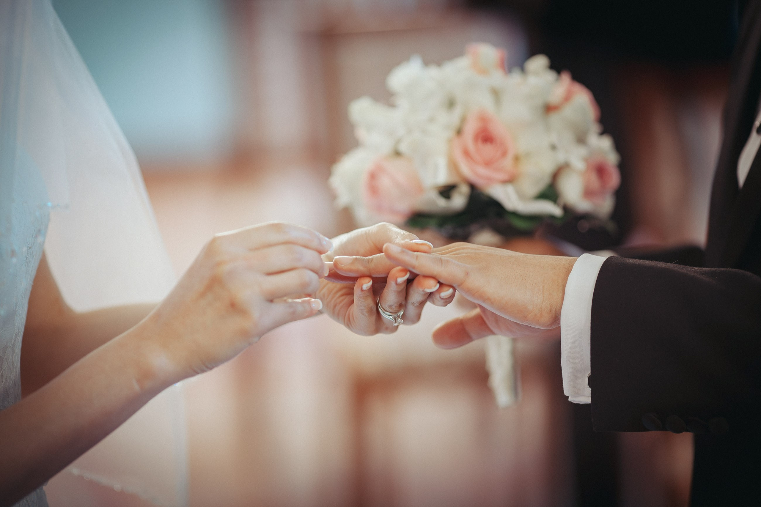 The exchanging of wedding rings during the wedding at Castle Hluboka.
