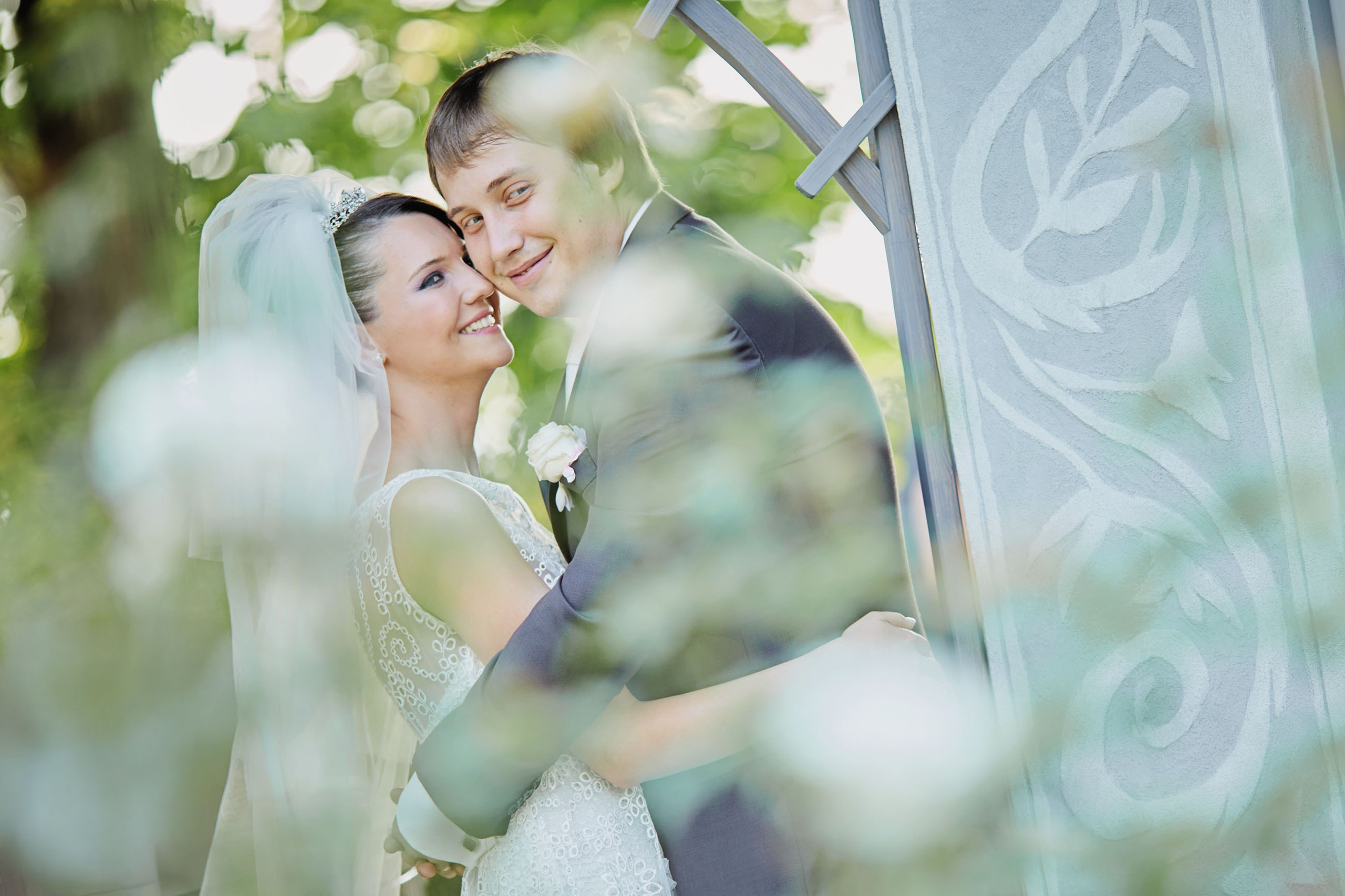 The bride and groom's love shines in Chateau Mcely's beautiful gardens, where they share a happy moment on their wedding day