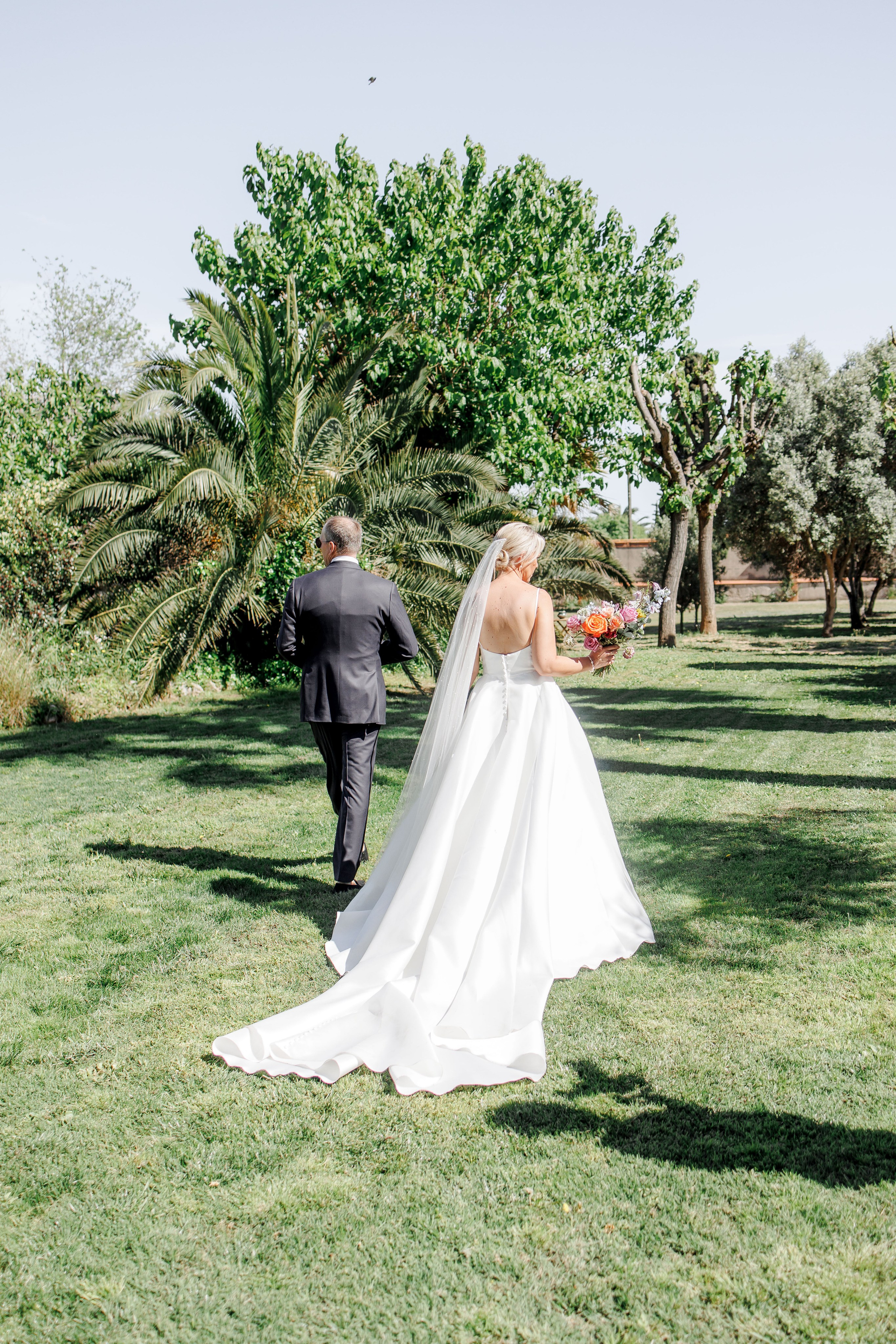 Romantic couple photo shoot in the gardens of the destination wedding venue, capturing love and joy.