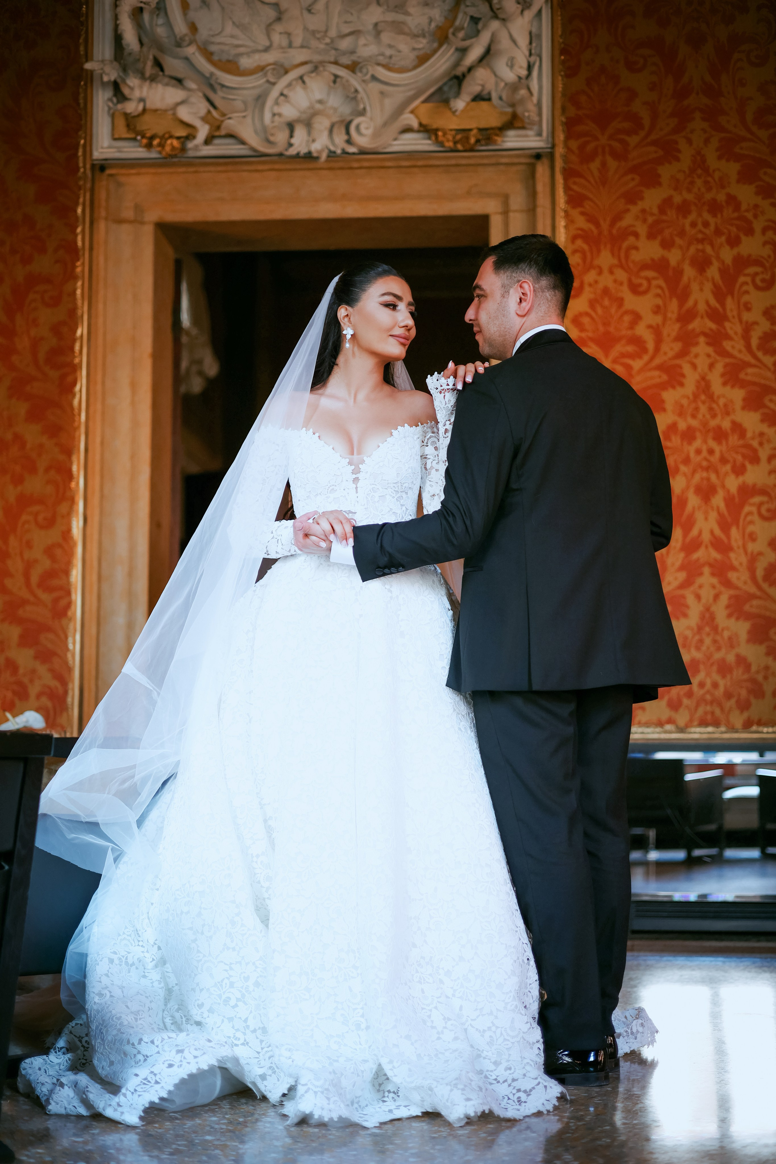 Elegant portrait of an Armenian bride and groom inside Aman Venice hotel