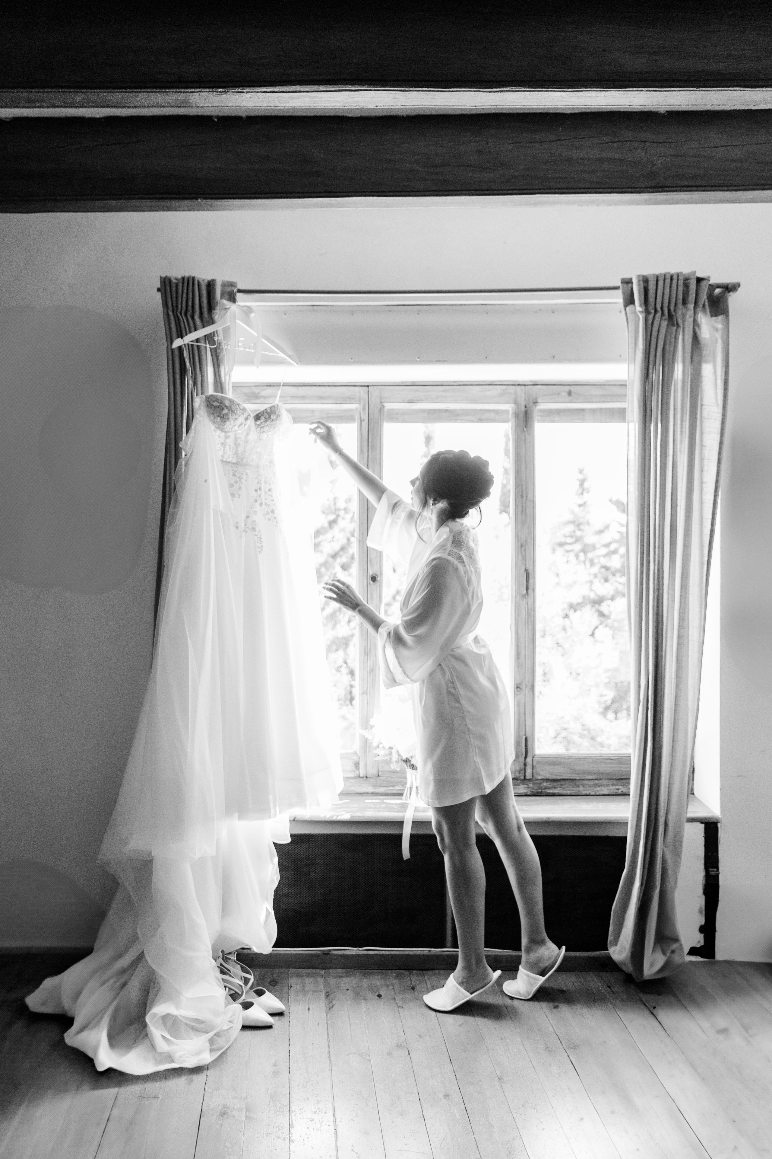 Bride getting ready in a room of the historical wedding venue La Baronia, capturing pre-wedding excitement.