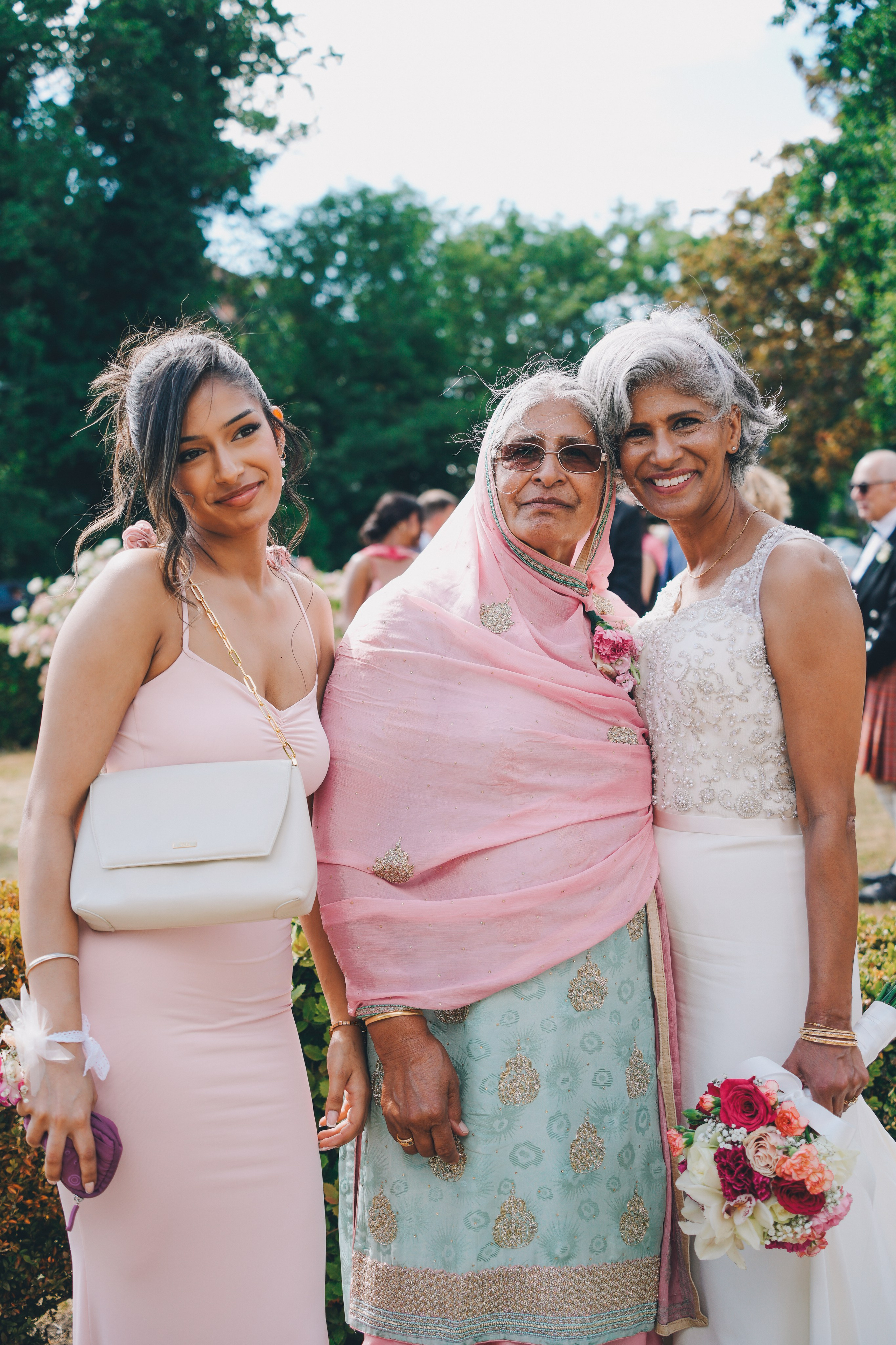Relaxed family gathering outside Solihull Register Office on wedding day