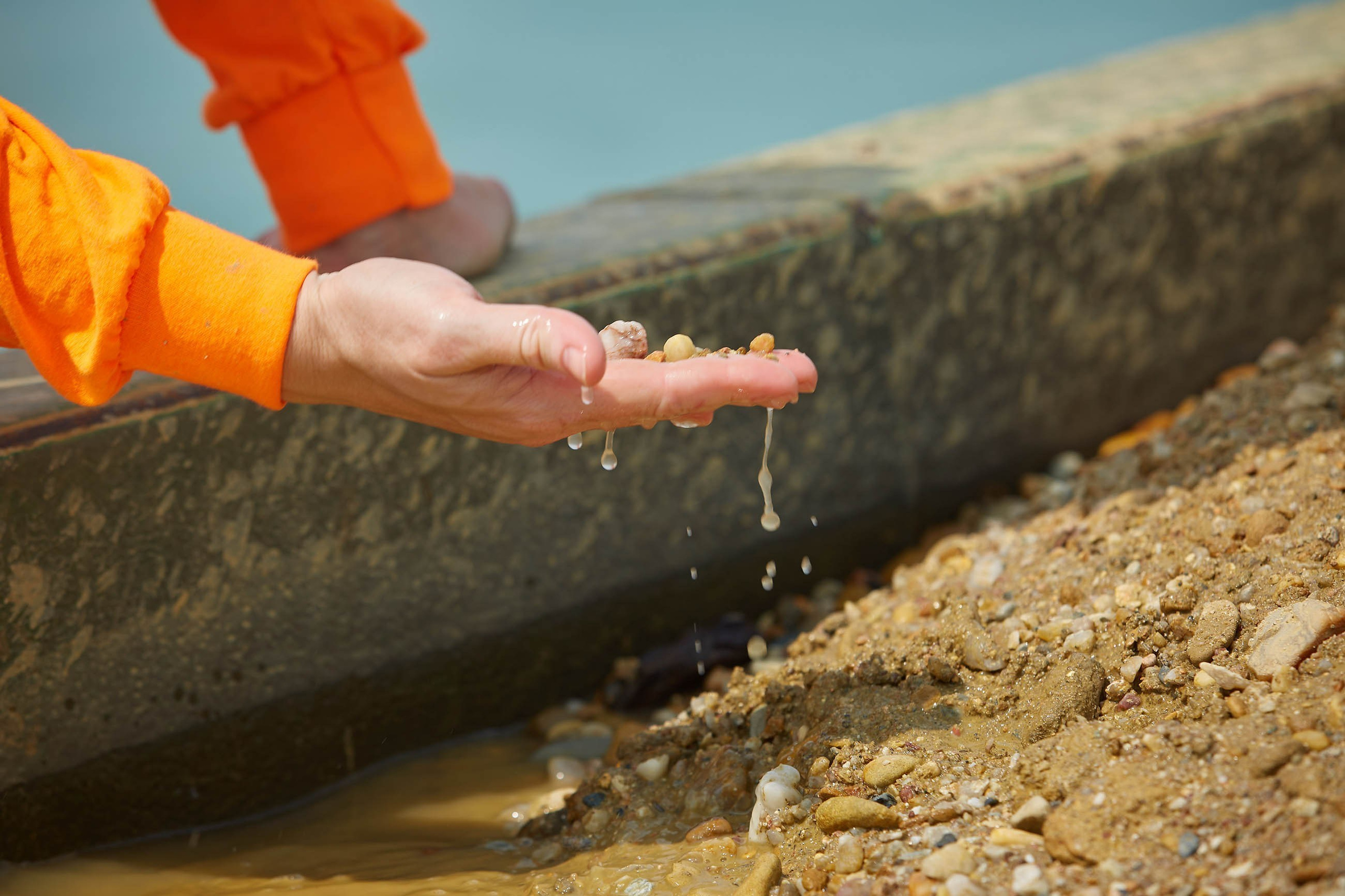 and checking dredged stone quality, close-up.