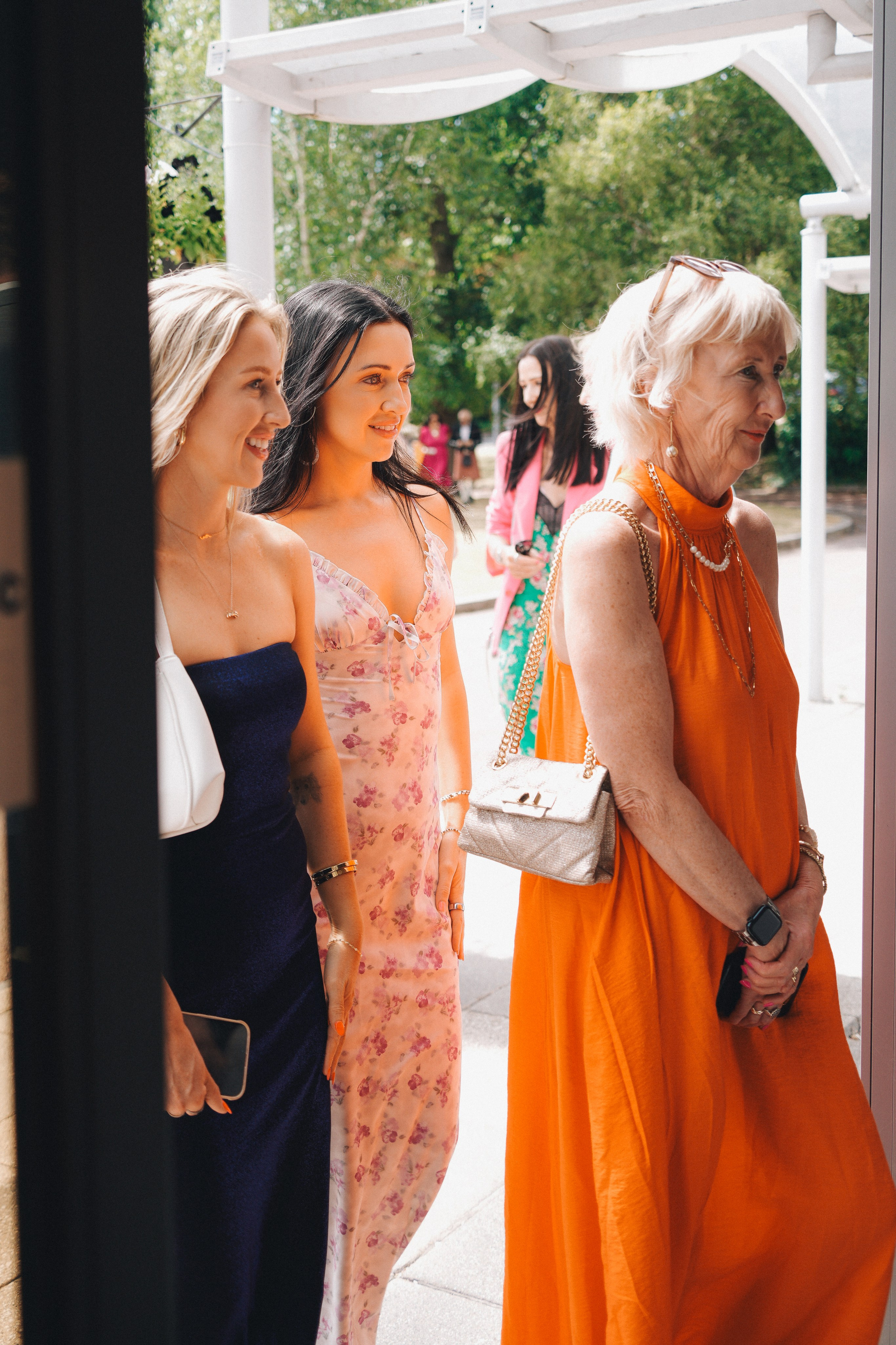 Guests greeting and hugging the bride and groom after the ceremony