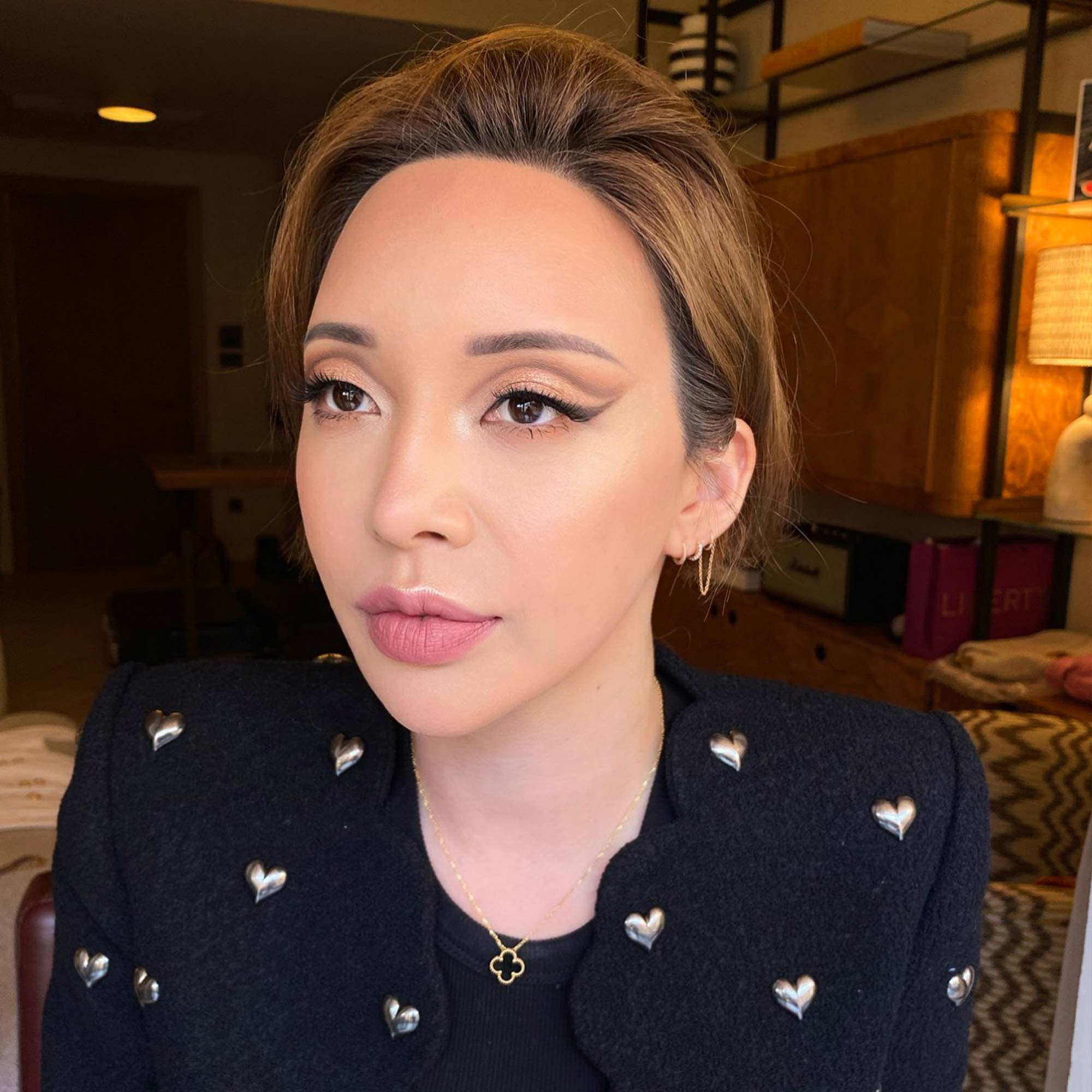 korean girl with soft cut crease makeup in neutral colors in Soho hotel in Rome