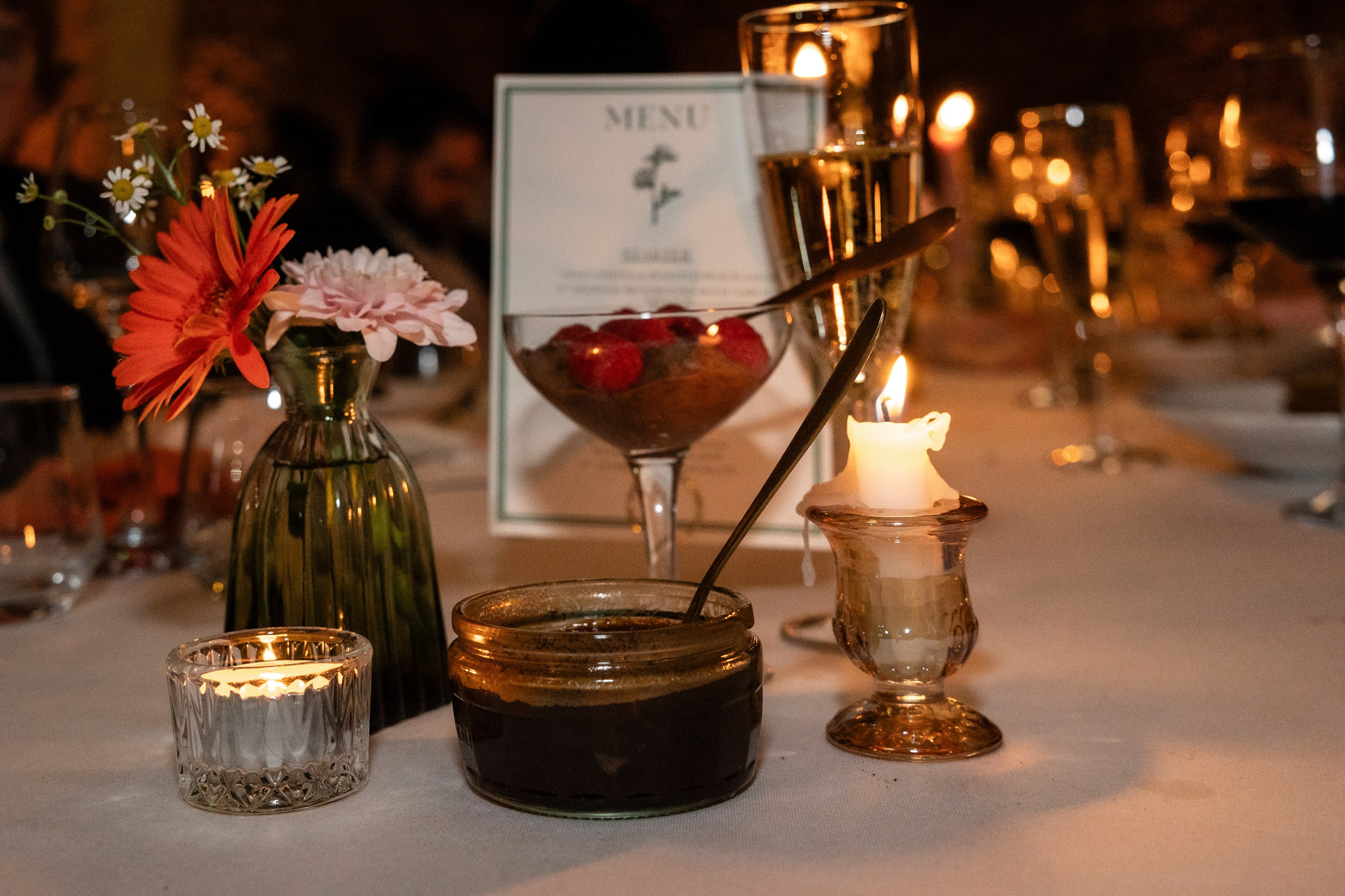 Candlelit wedding dinner indoors at Château Lagut, Dordogne France.