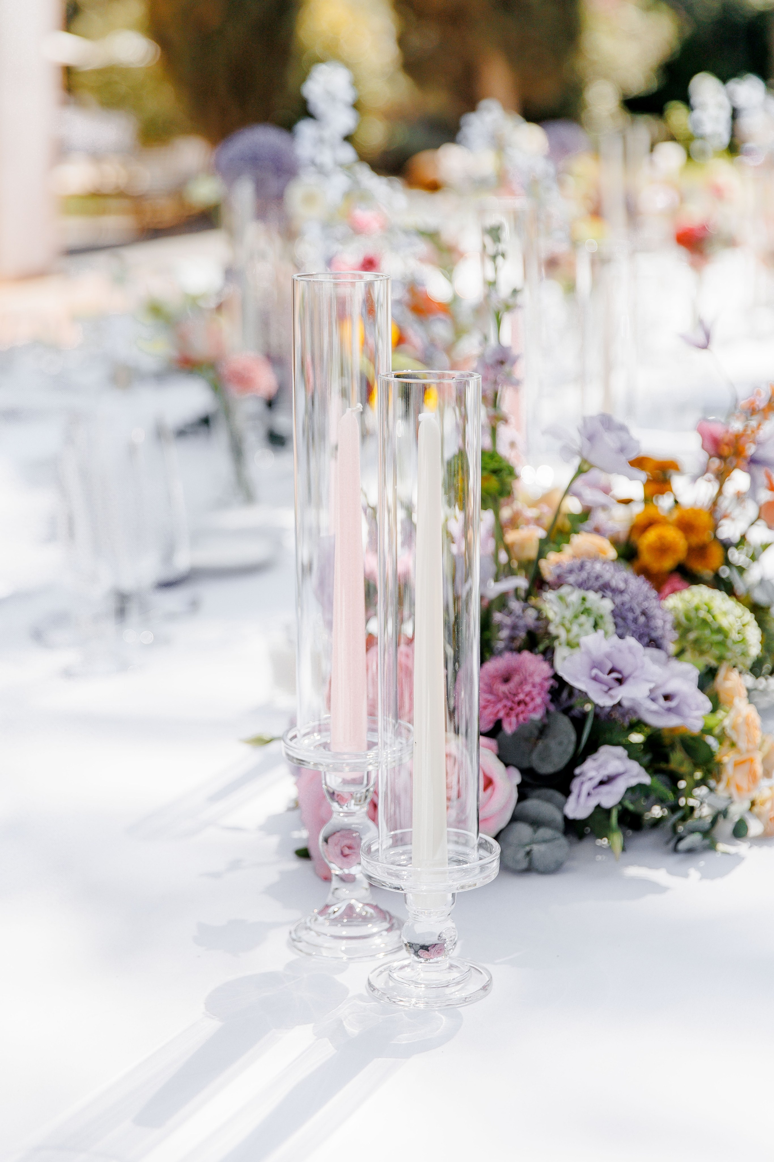 Elegant summer reception setup, featuring beautiful table settings and floral decor.
