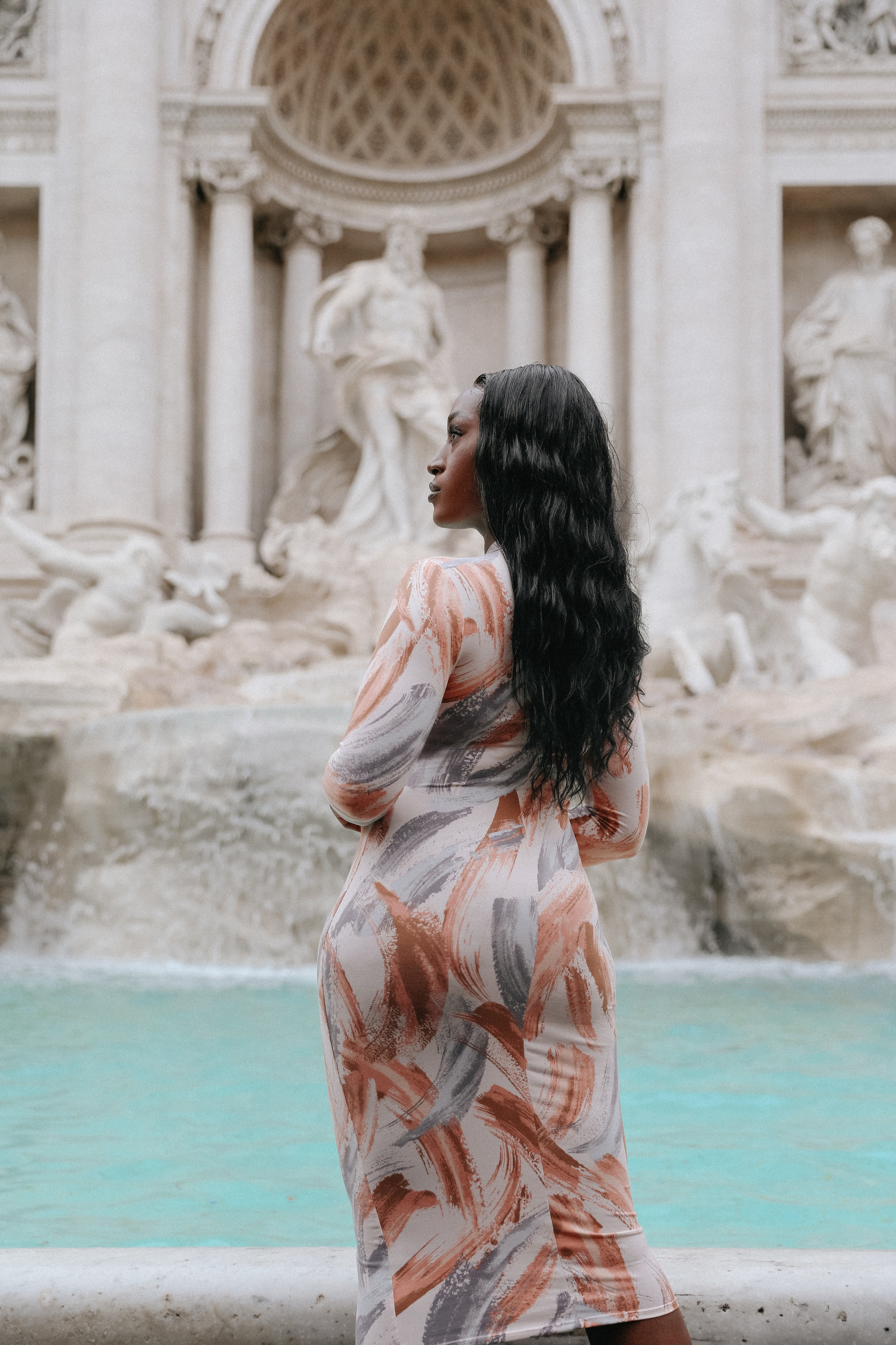 THREE COINS IN THE TREVI FOUNTAIN. Photographer in Rome