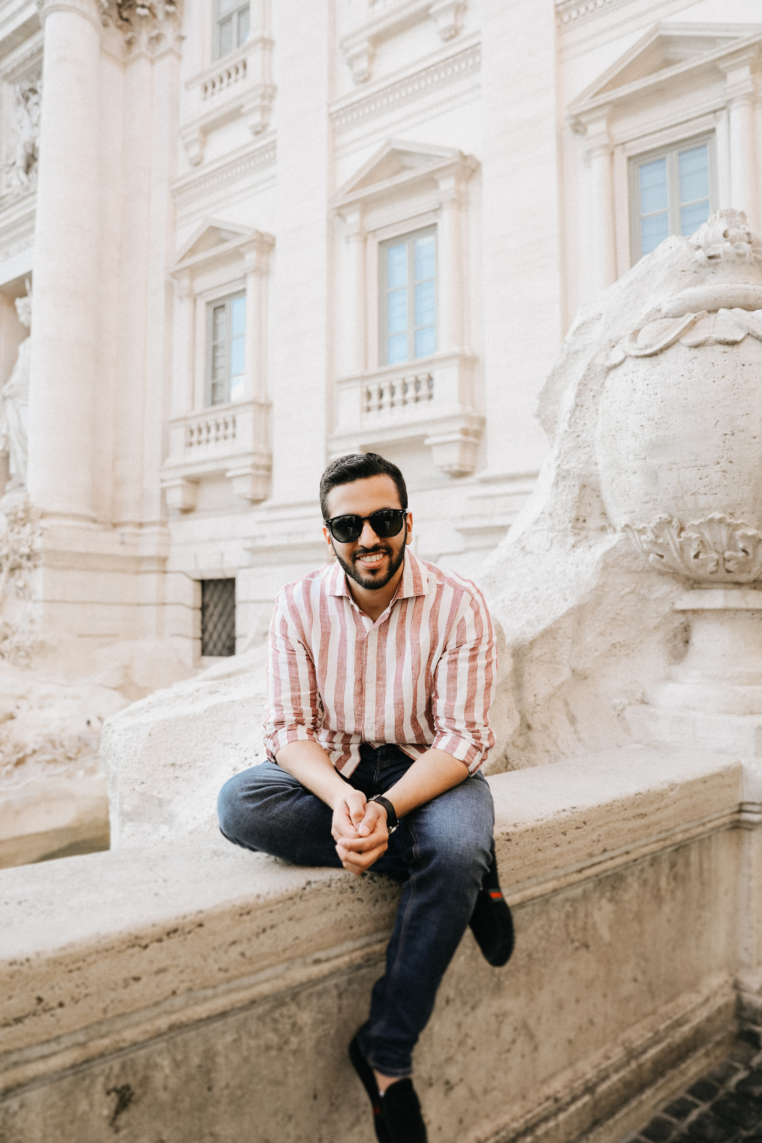 THREE COINS IN THE TREVI FOUNTAIN. Photographer in Rome