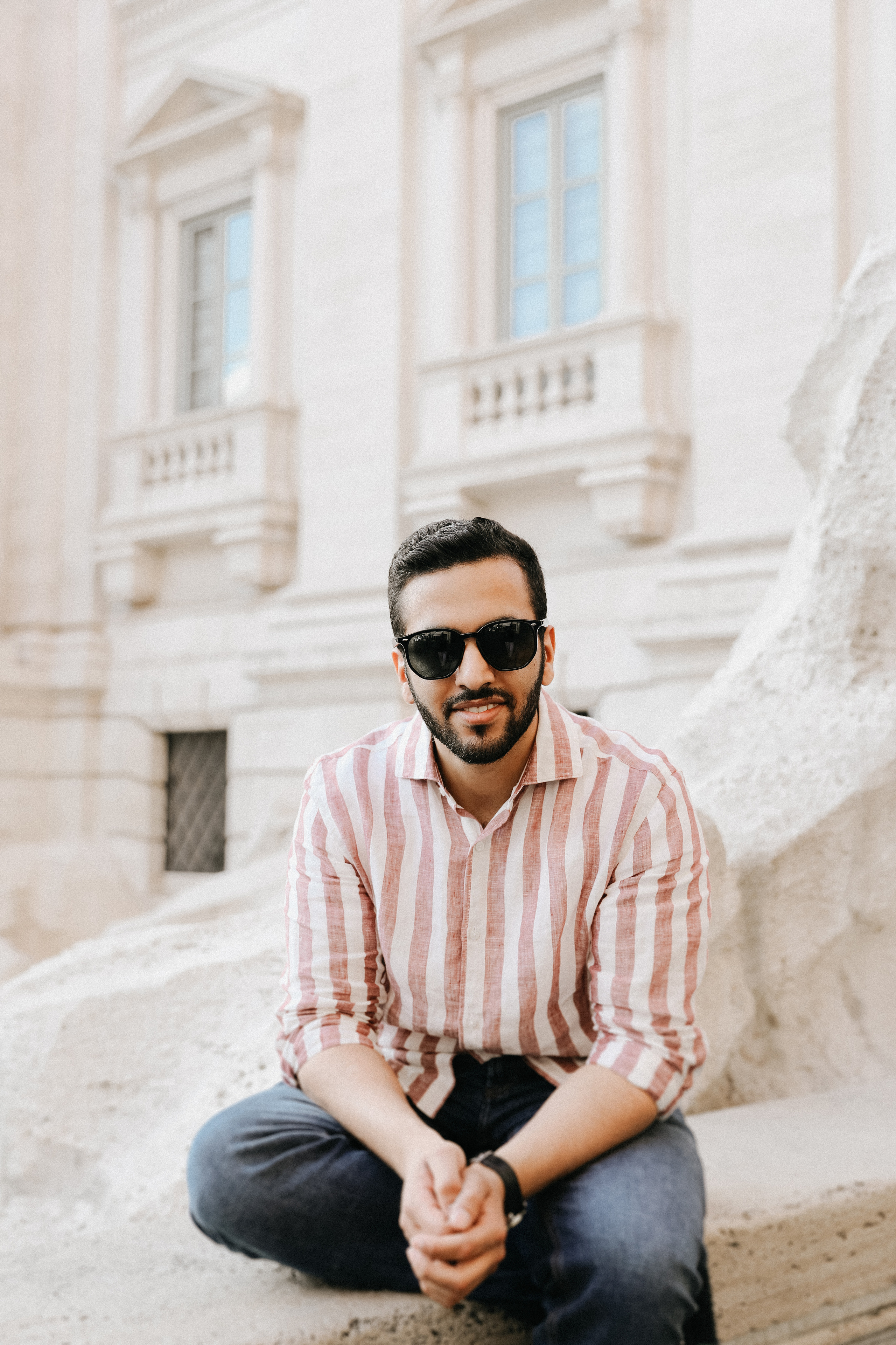 THREE COINS IN THE TREVI FOUNTAIN. Photographer in Rome