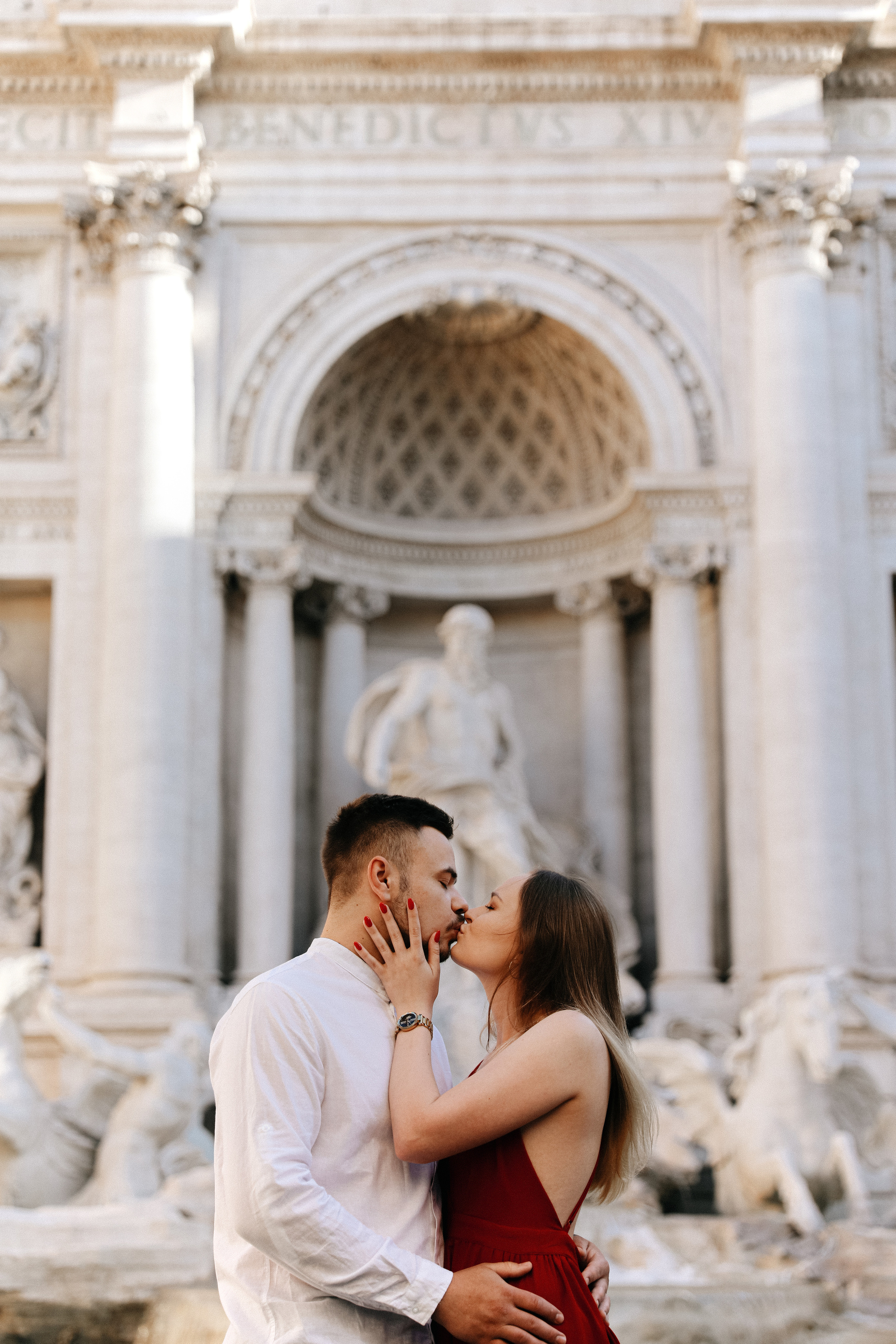 THREE COINS IN THE TREVI FOUNTAIN. Photographer in Rome