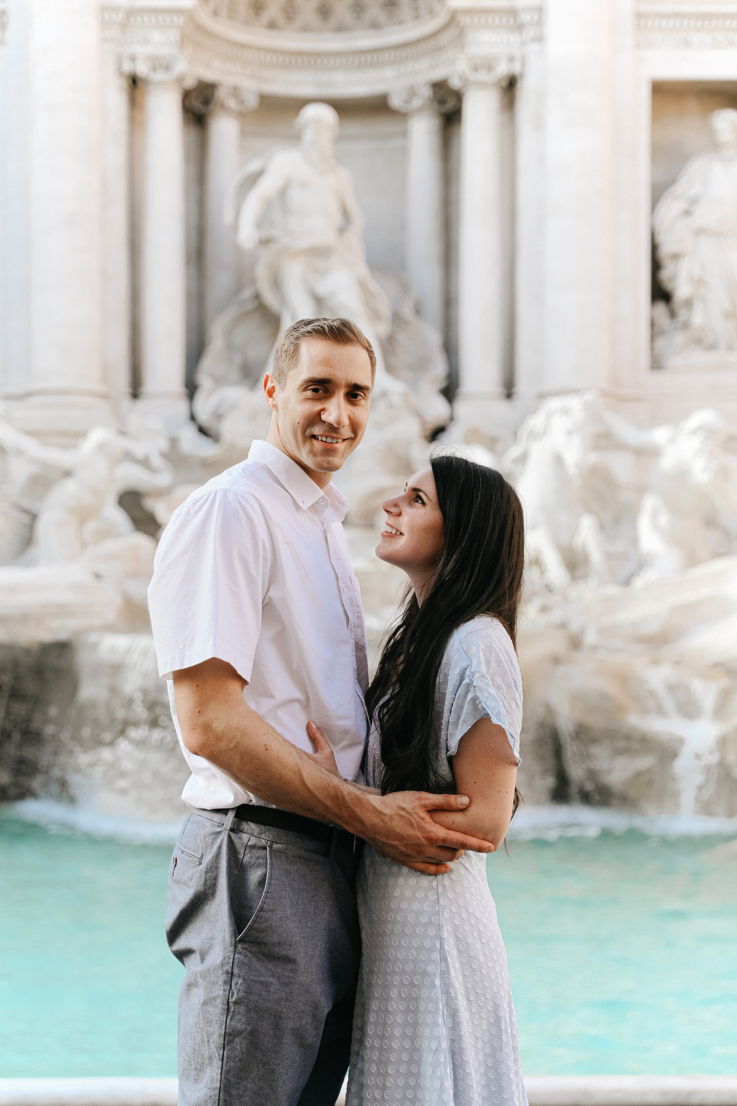 THREE COINS IN THE TREVI FOUNTAIN. Photographer in Rome