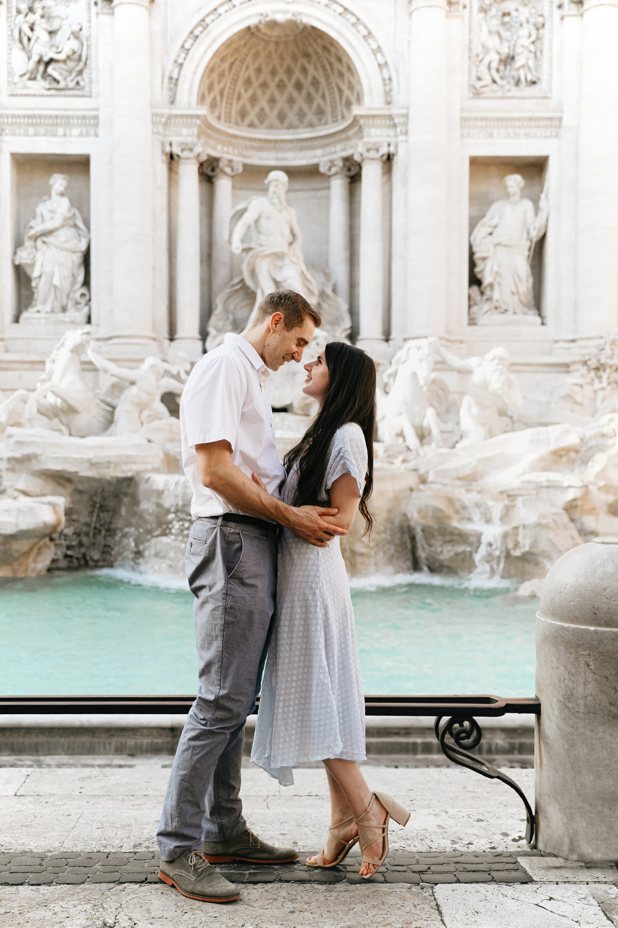 THREE COINS IN THE TREVI FOUNTAIN. Photographer in Rome