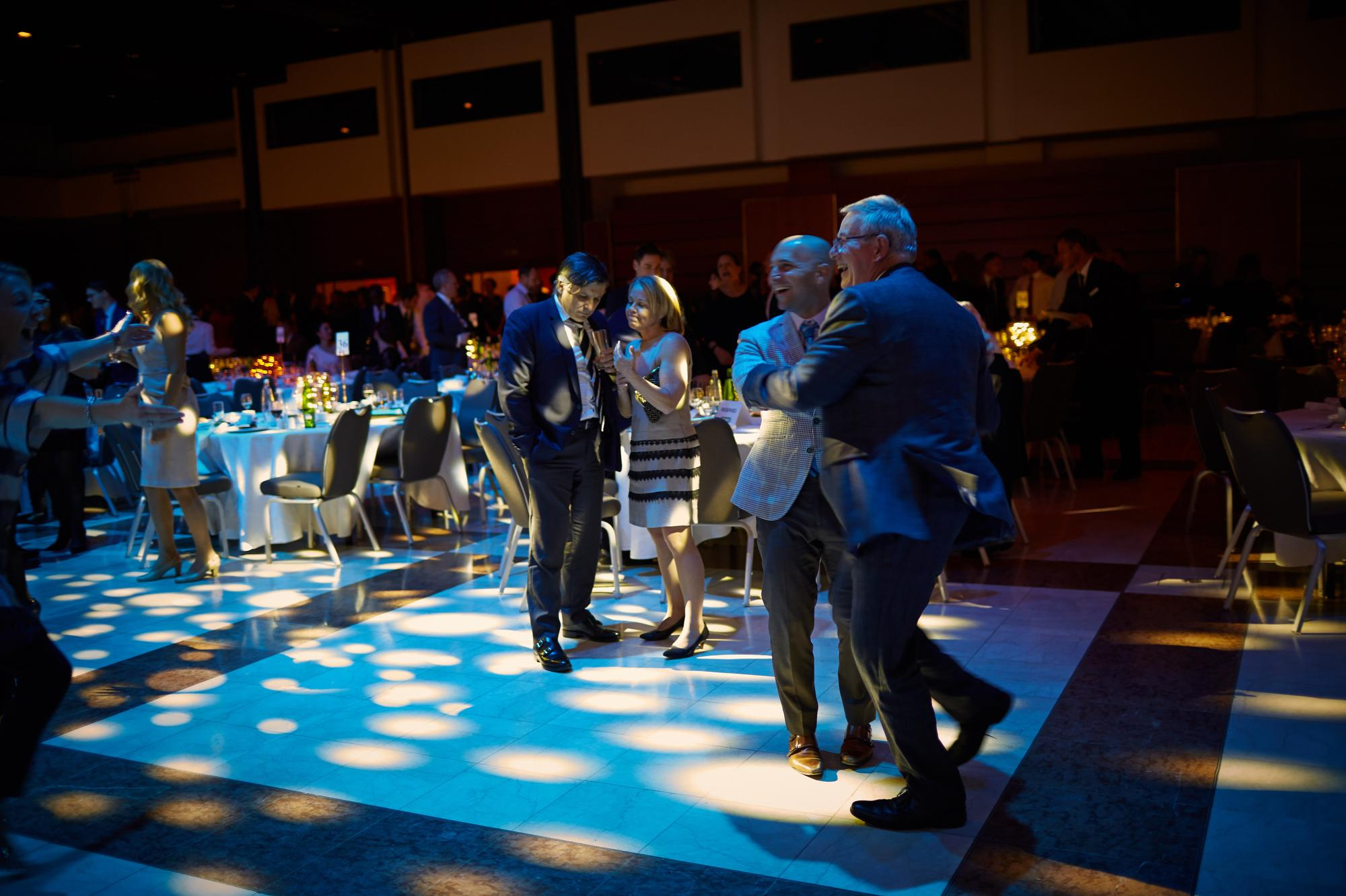 Attendees dance through the night atop the dance floor.