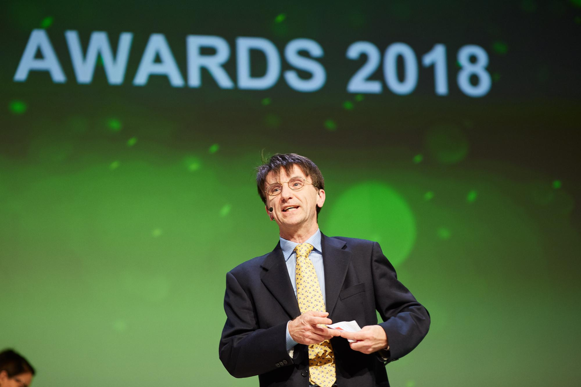 An executive on stage gives a speech during the 2018 gala event.
