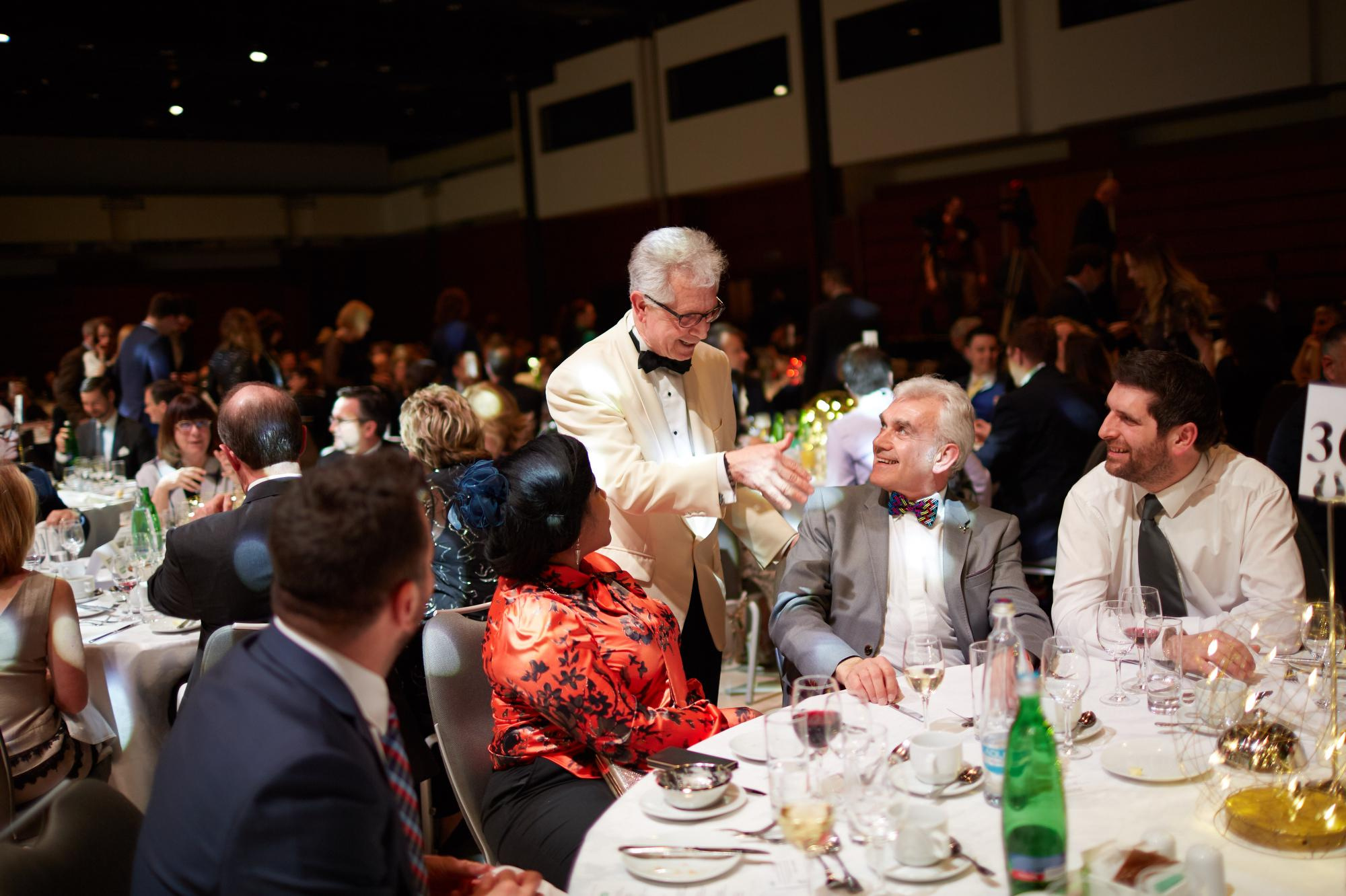 A smartly dressed executive greets attendees during the 2018 Bio-Rad gala held at the Hotel Hilton, Prague.