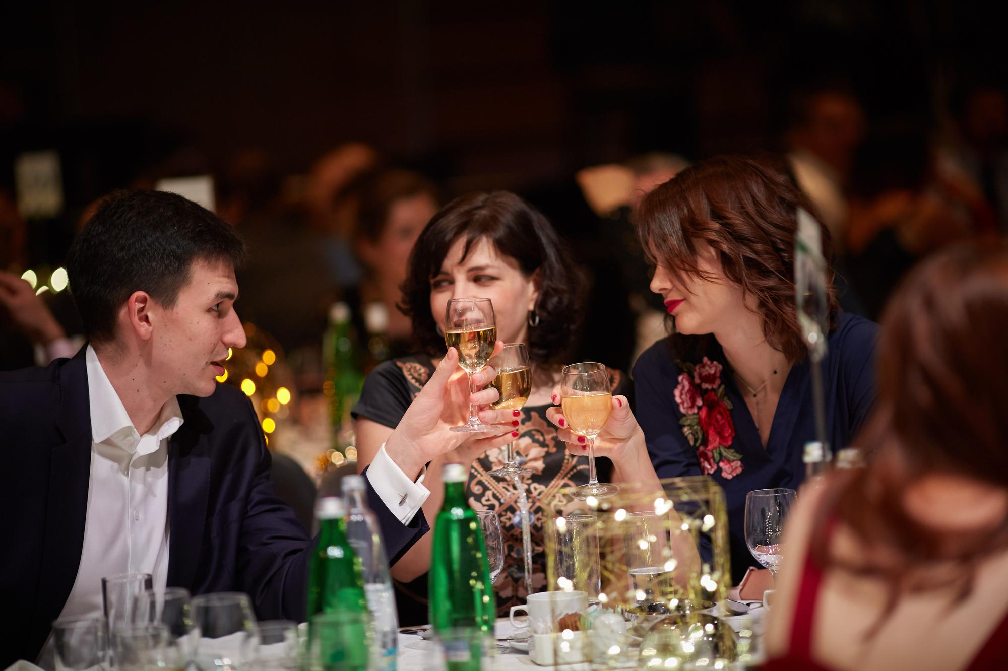 Attendees share a toast during the gala event.