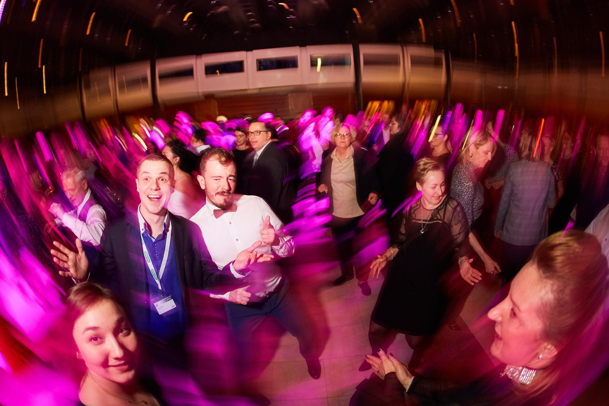 Smiling Bio-Rad attendees party on during their gala event in the Prague ballroom.