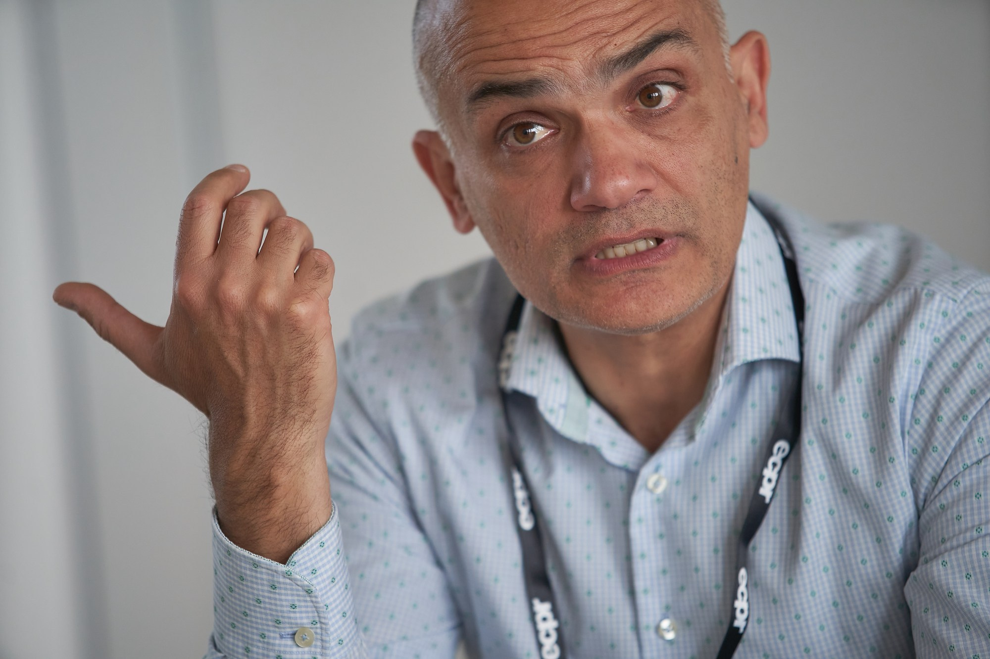 A senior scholar moderates a discussion in a compact ECPR workshop setting.