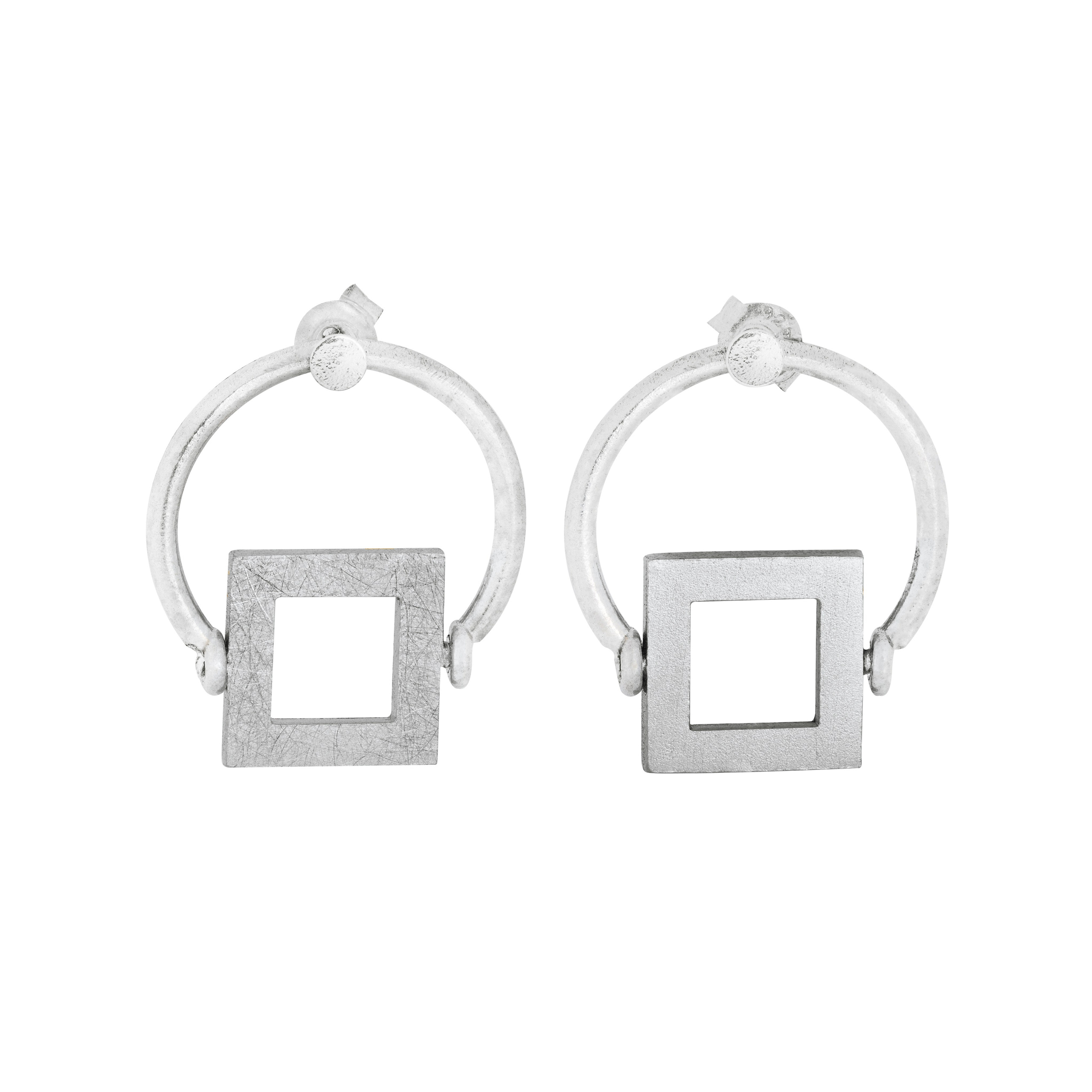 Modern jewelry pieces photographed with a clean, white background for an online store.