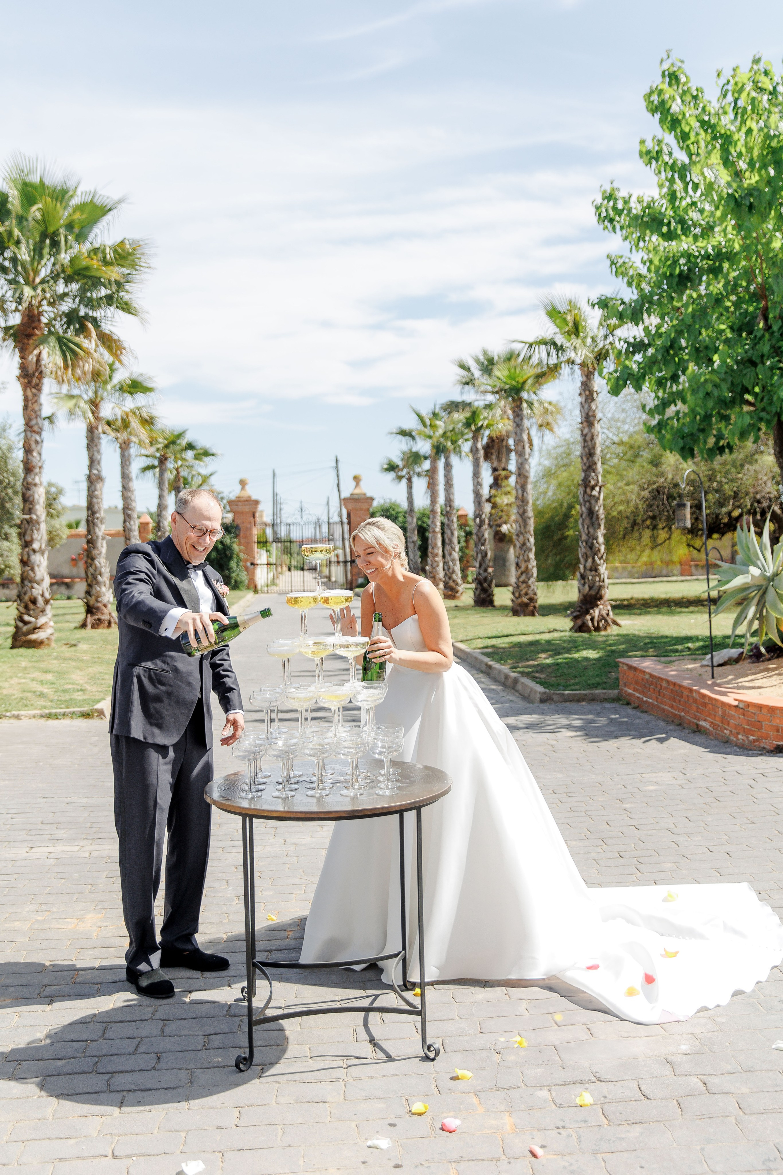 Champagne toast captured during a luxury destination wedding in Spain