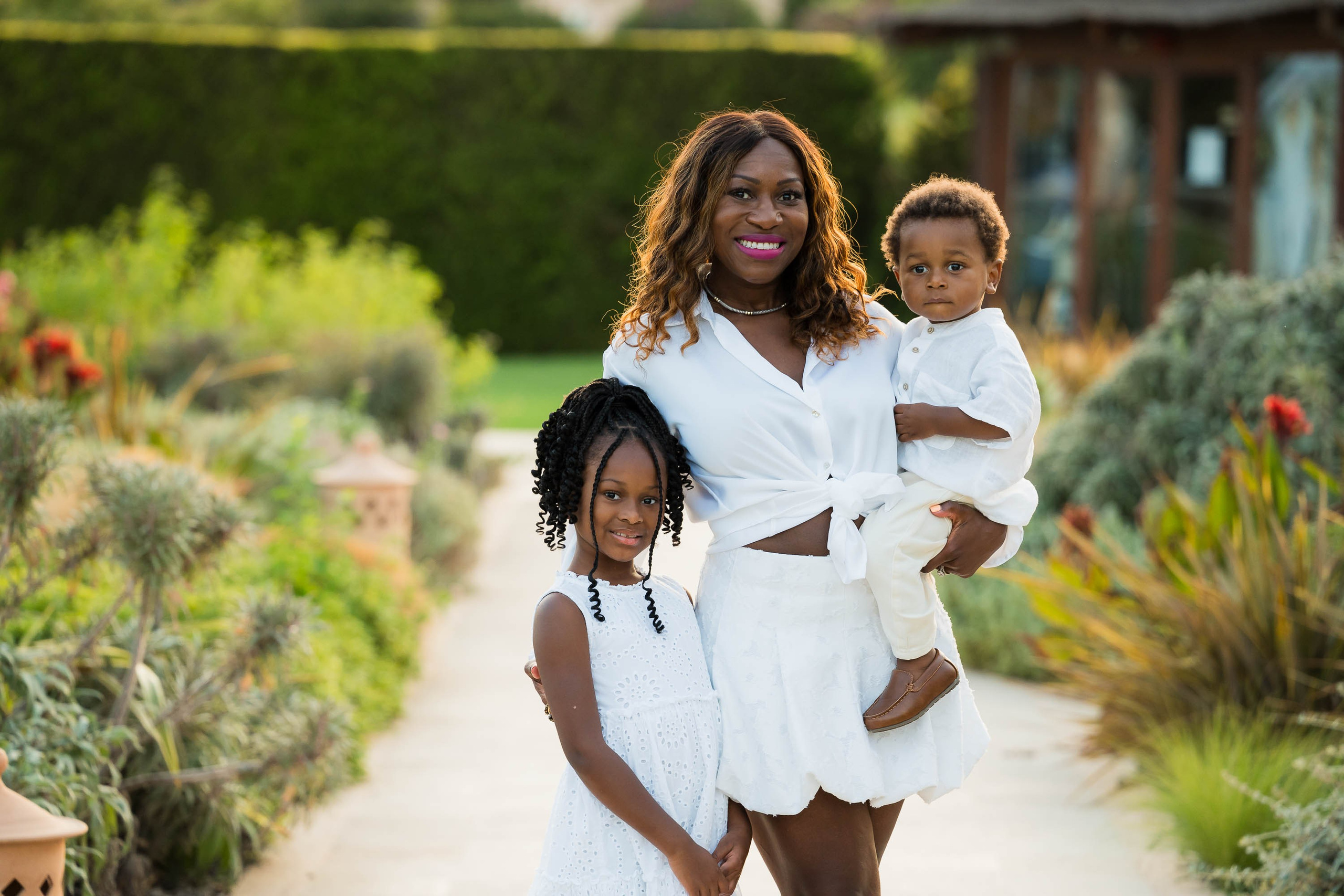 Mother and children having Family Portraits at St. Regis Mardavall in Mallorca