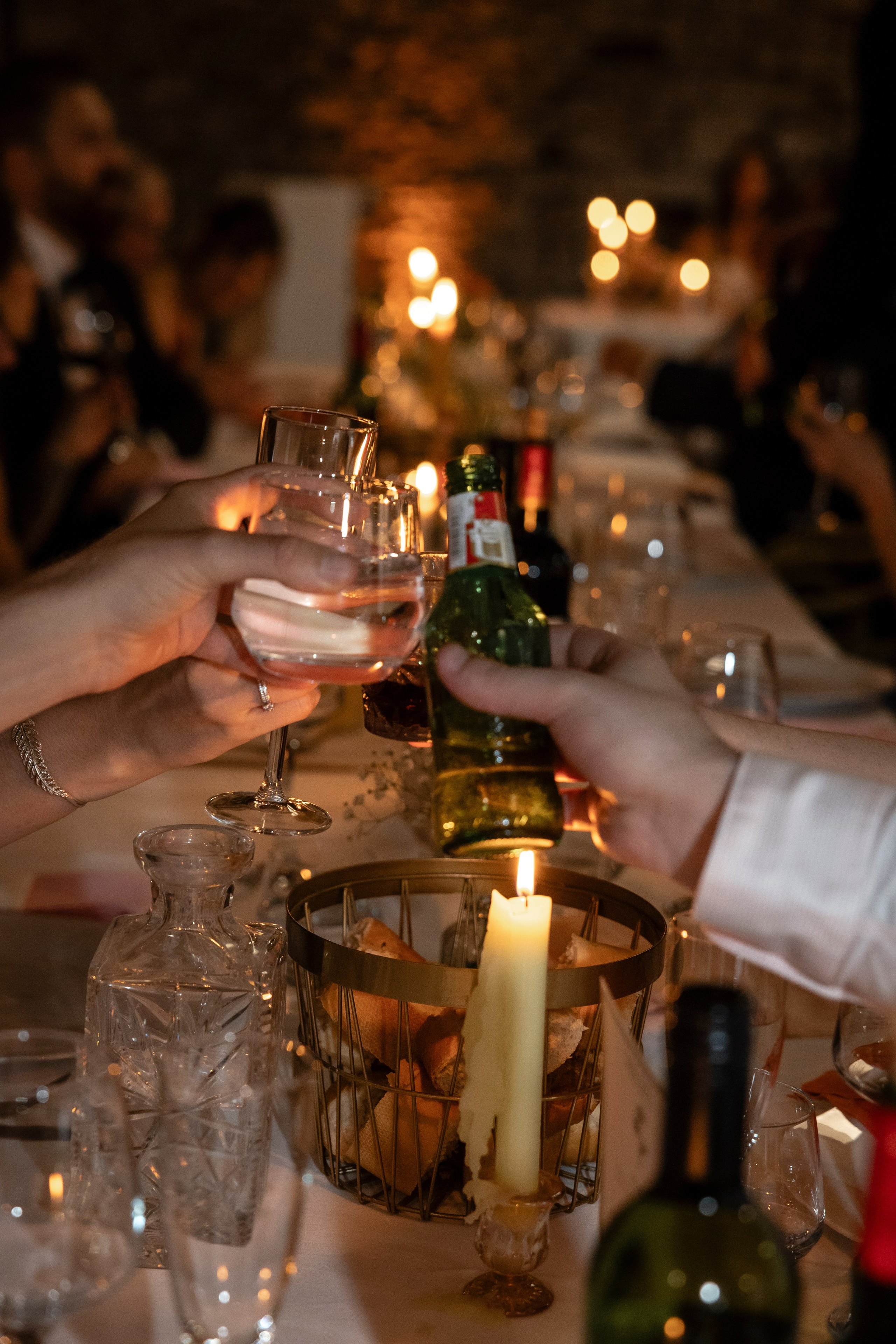 Candlelit wedding dinner indoors at Château Lagut, Dordogne France.