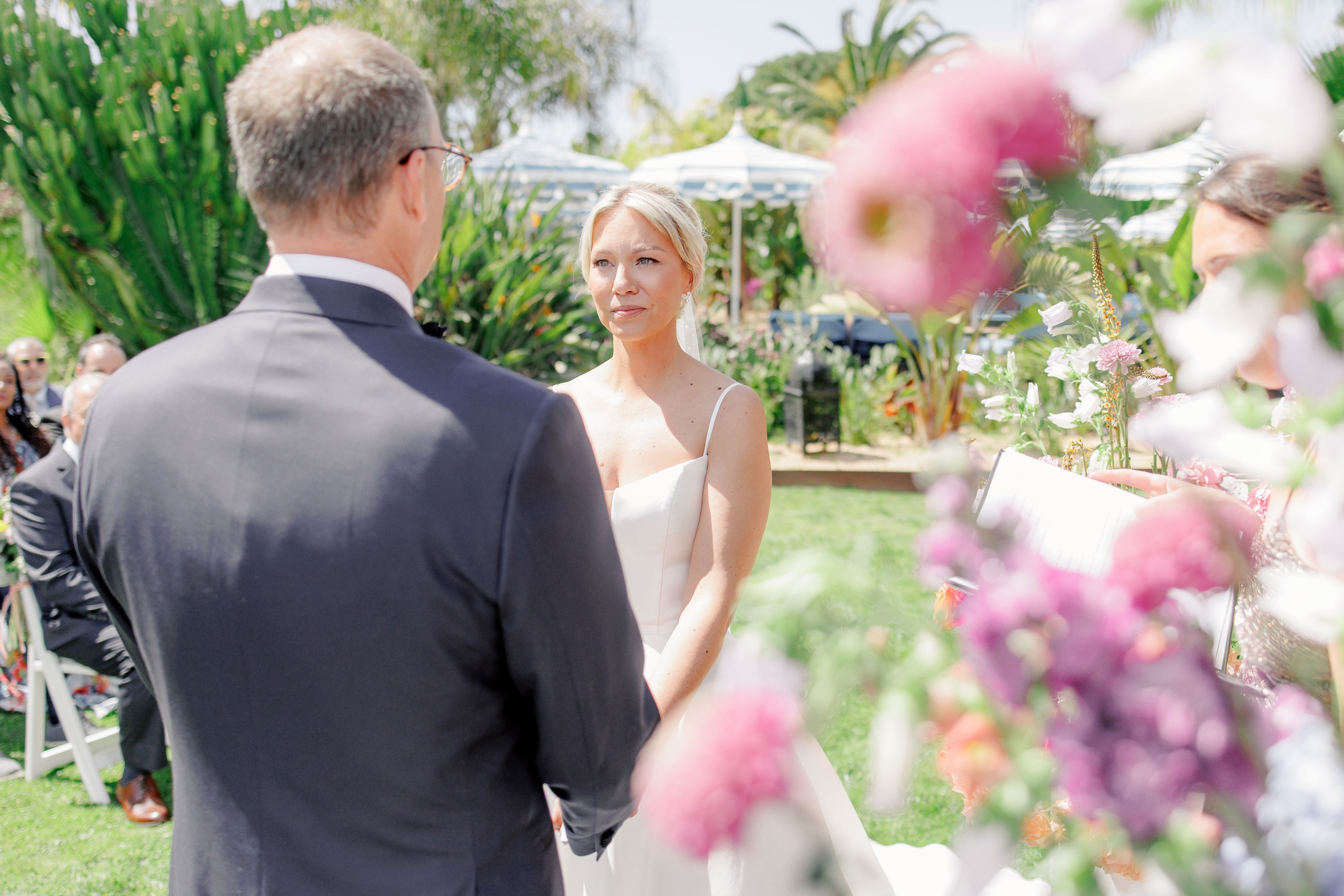 Couple exchanging vows at a luxury destination wedding in Costa