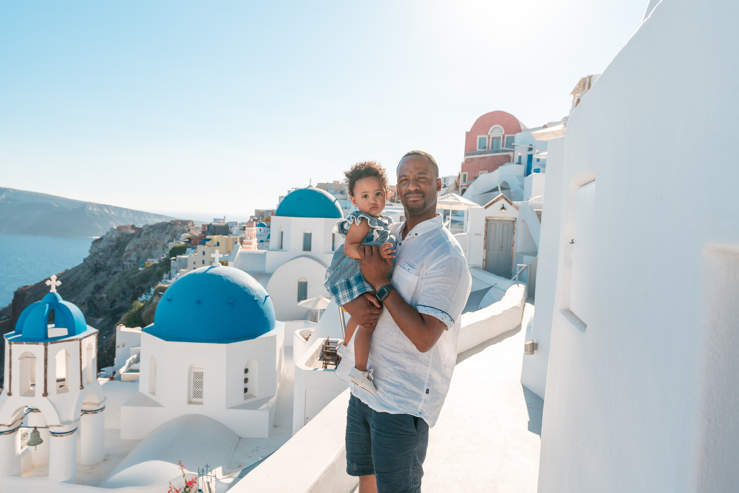 "Experience a magical family photoshoot in Santorini! From whitewashed streets to breathtaking sea views, let us preserve your happiest moments with beautifully edited, high-quality images."